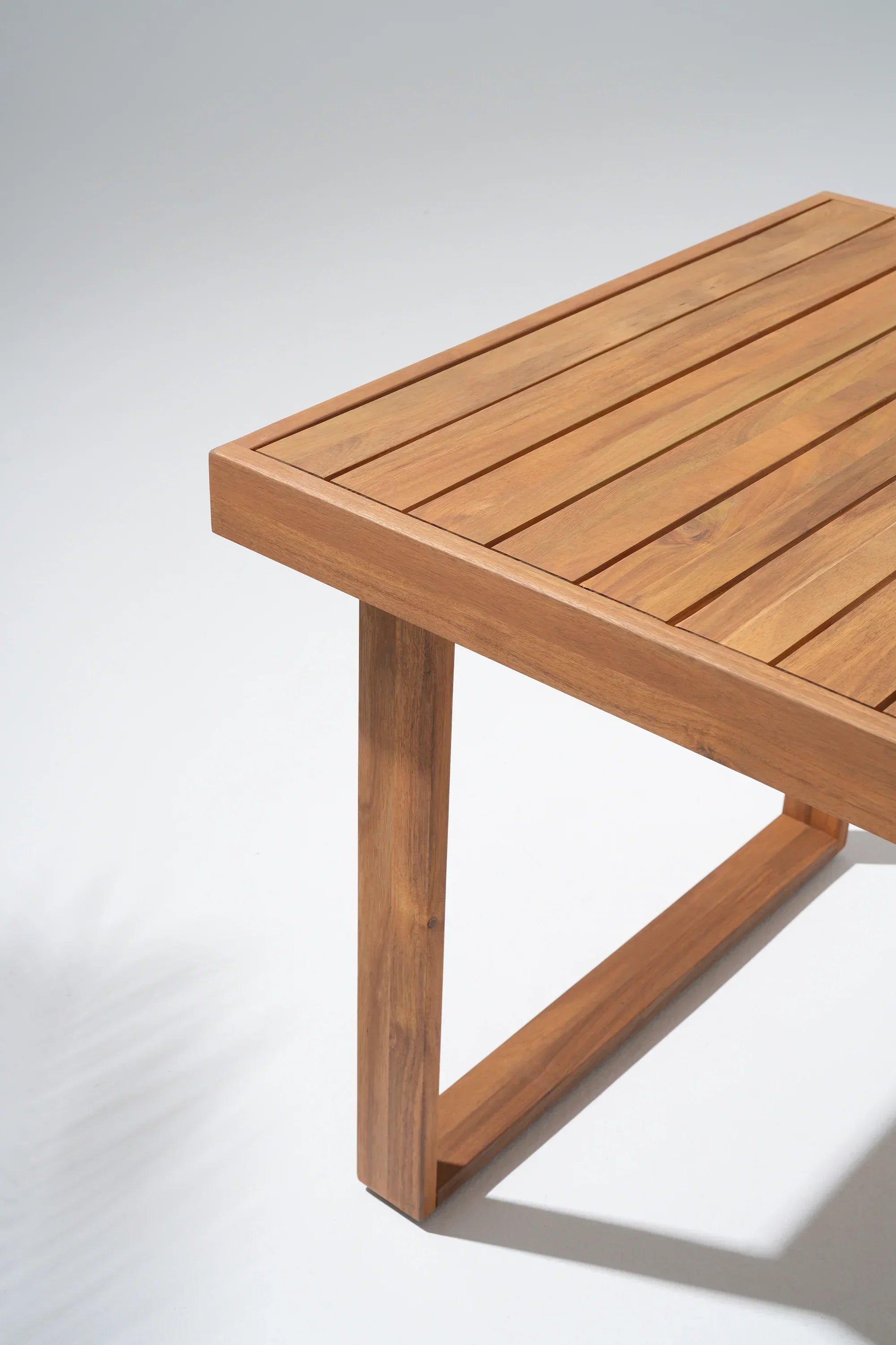 close up of acacia Wooden table leg and tabletop