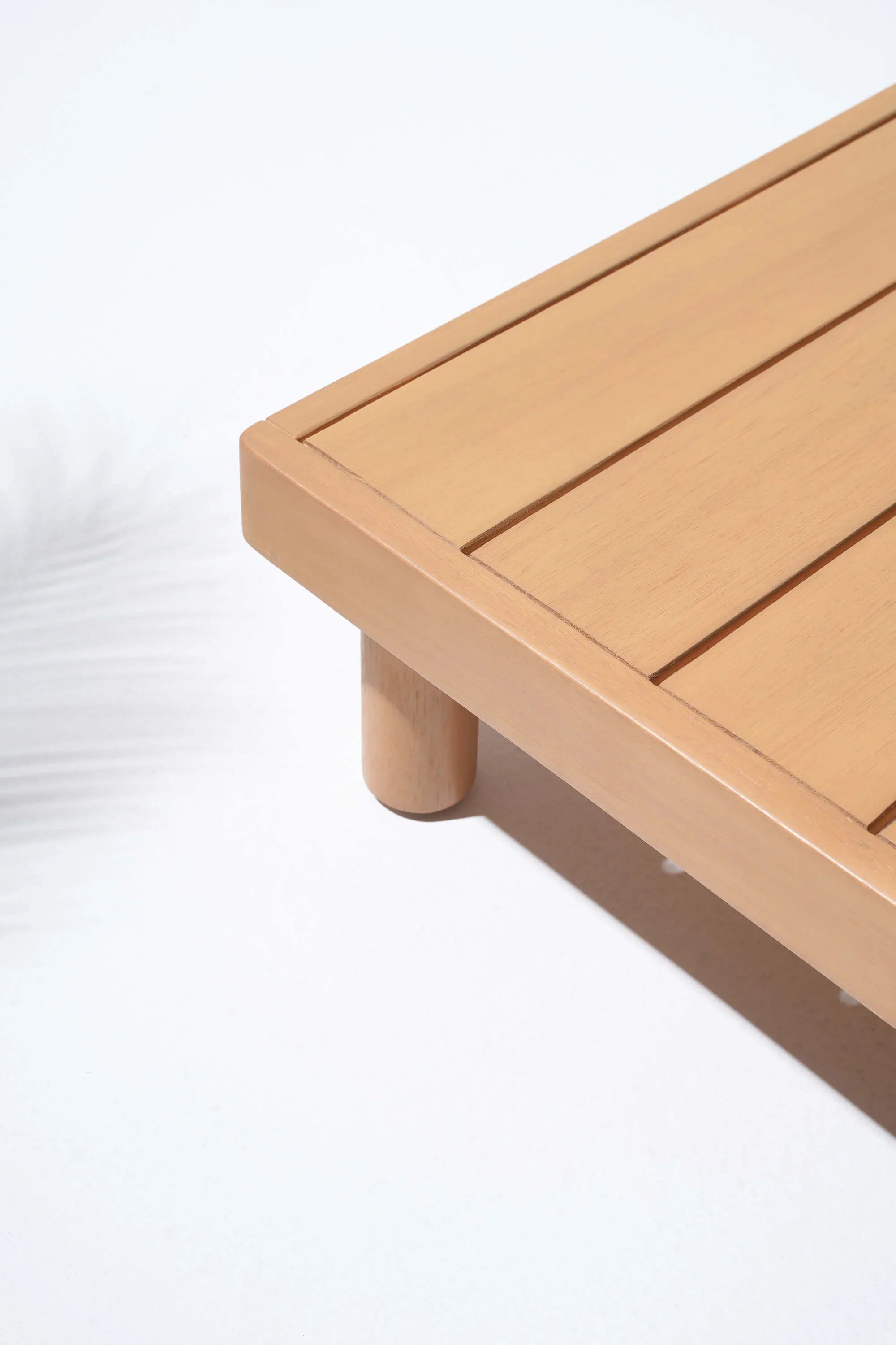 Wooden coffee table with a light brown finish