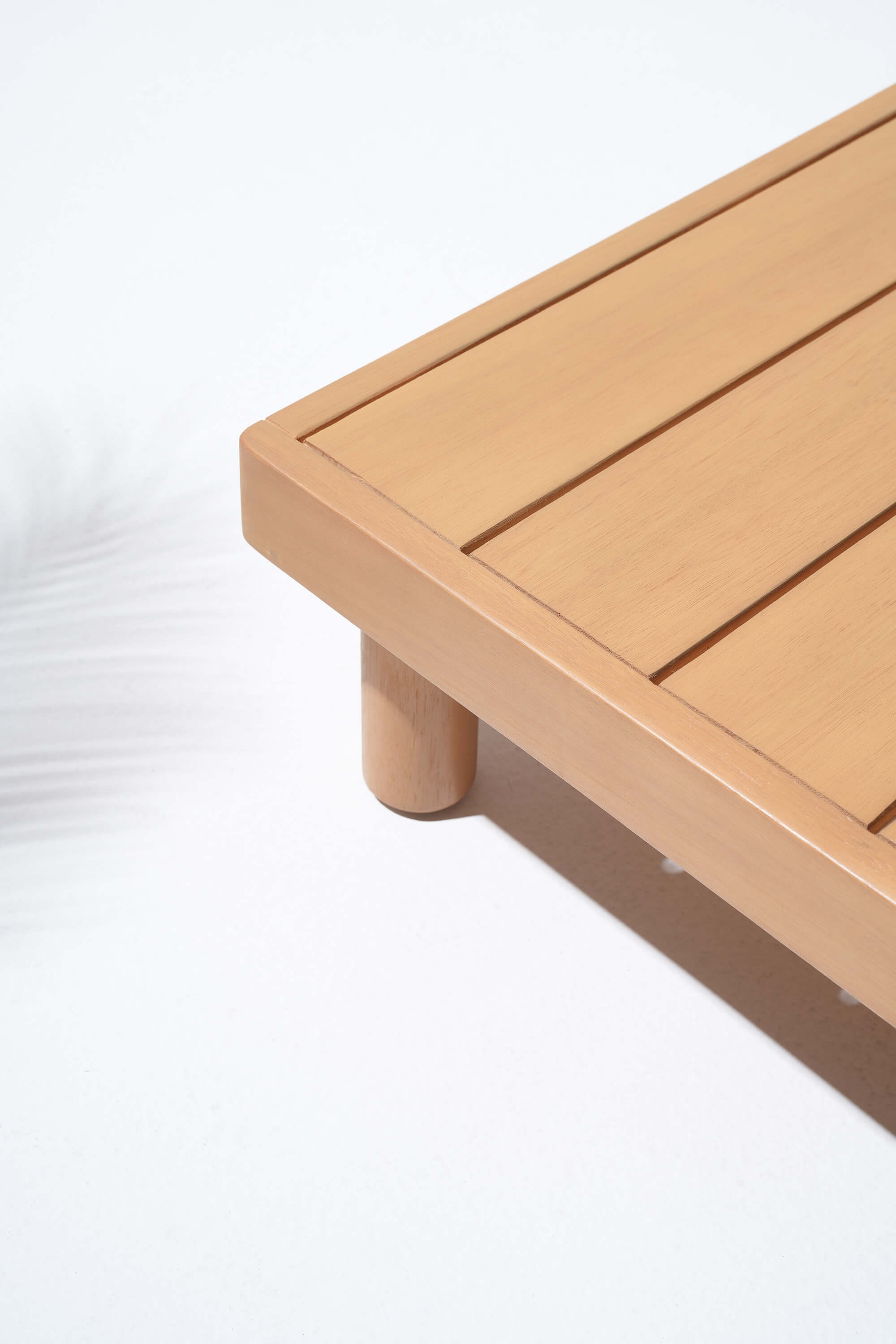 Wooden coffee table with a light brown finish