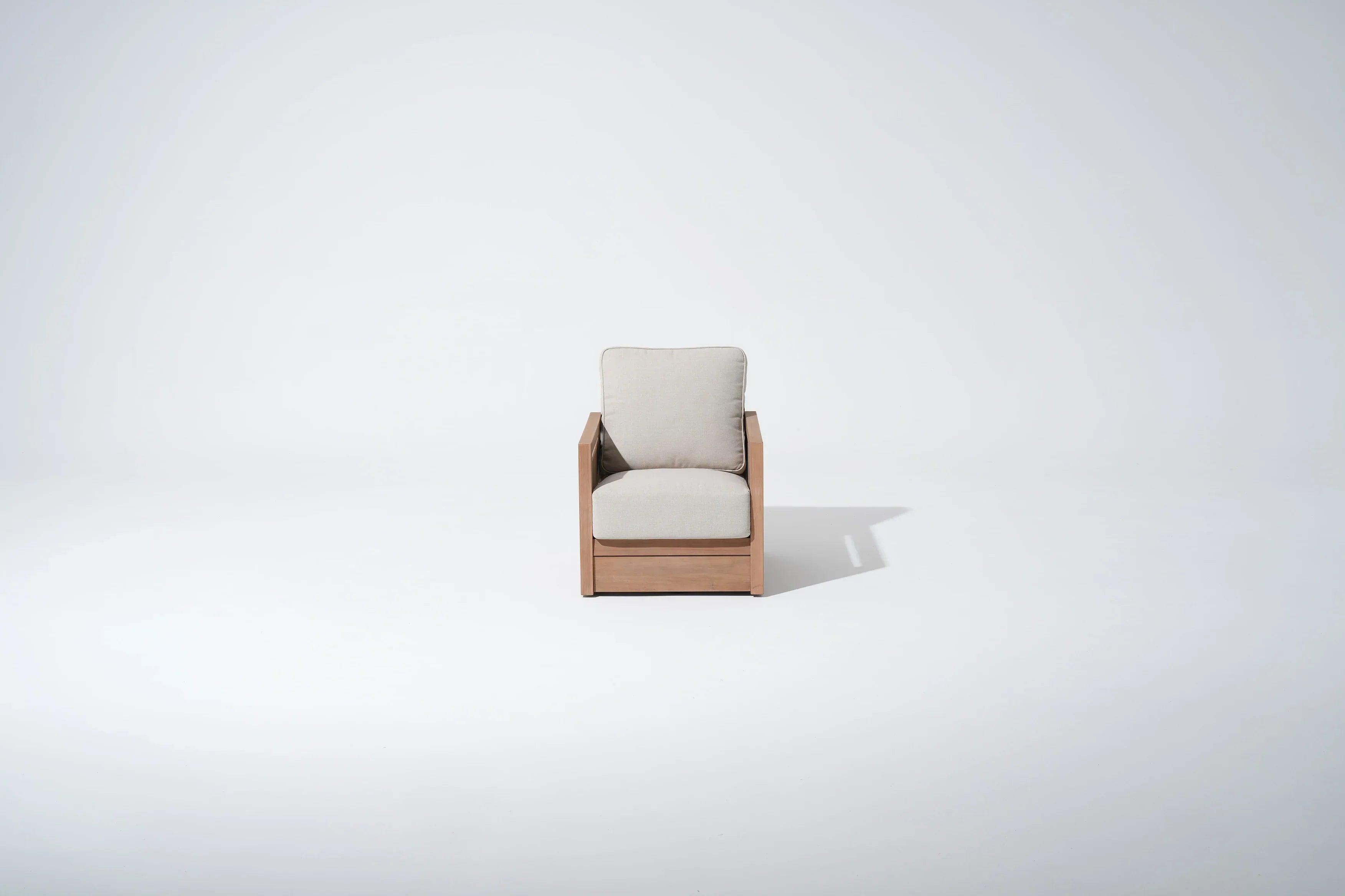 Modern armchair with acacia wooden frame and beige cushion