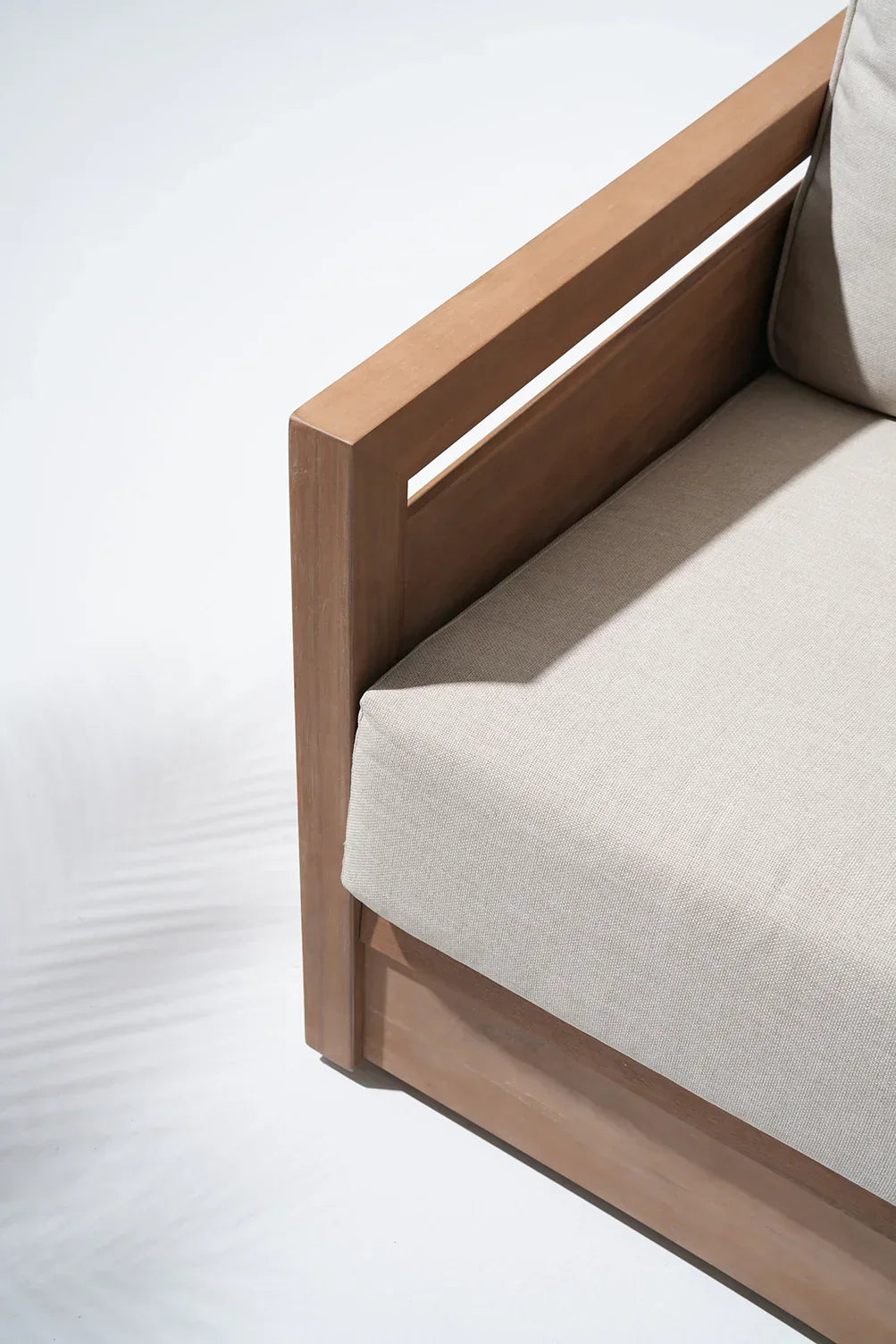 acacia Wooden outdoor sofa with beige cushions, side detail