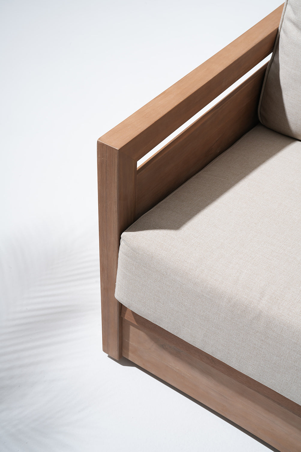 acacia Wooden outdoor sofa with beige cushions, side detail