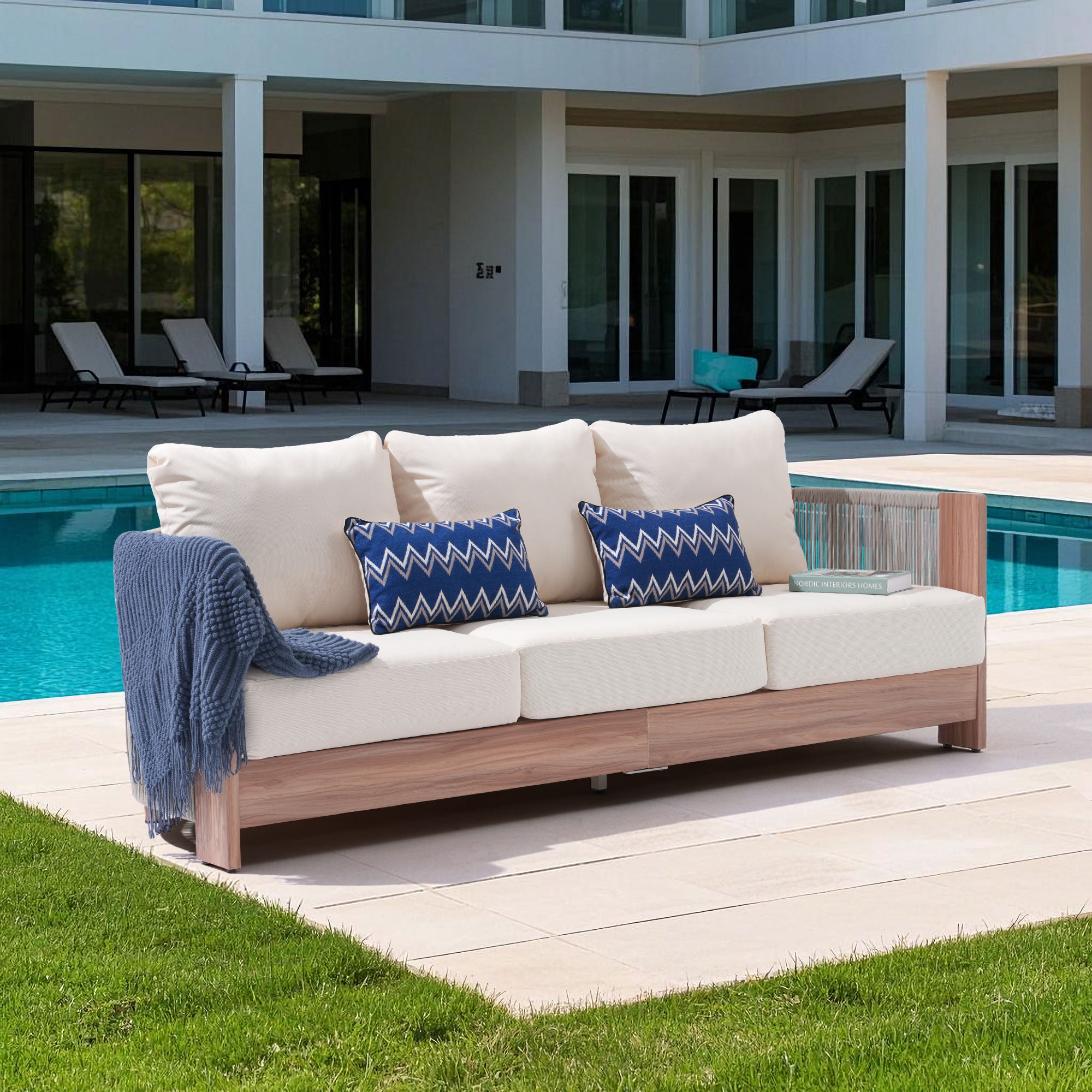 Outdoor 3-seat sofa with thick cushions by a poolside, hand woven rope design