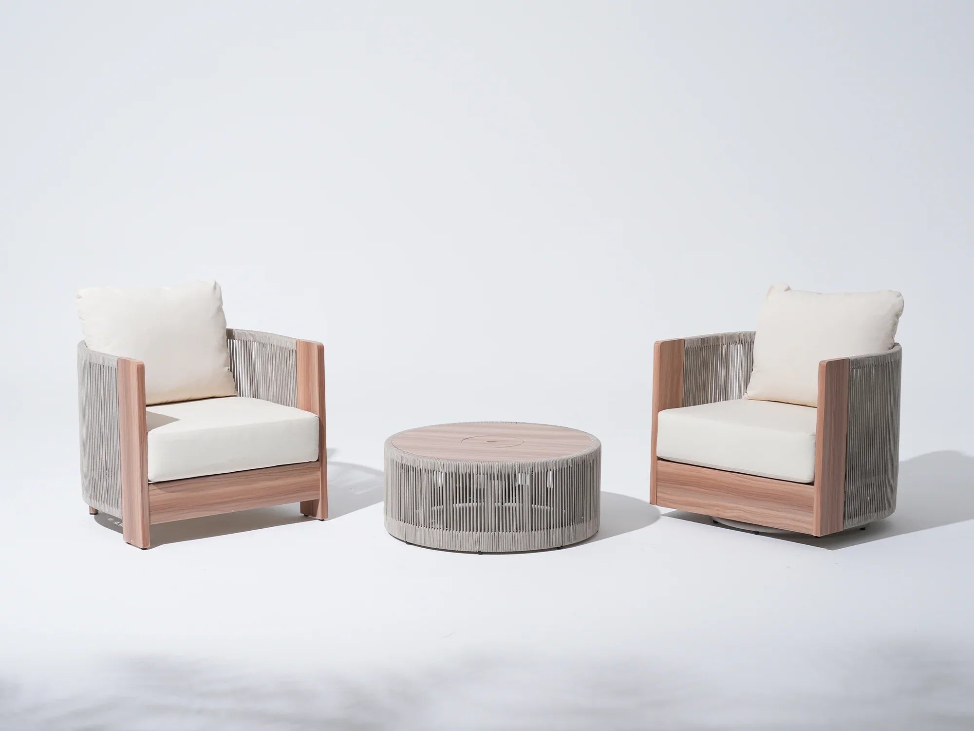 3-pc patio bistro set with white cushions, one wooden armchair, one swivel chair, and a matching round table, rope design