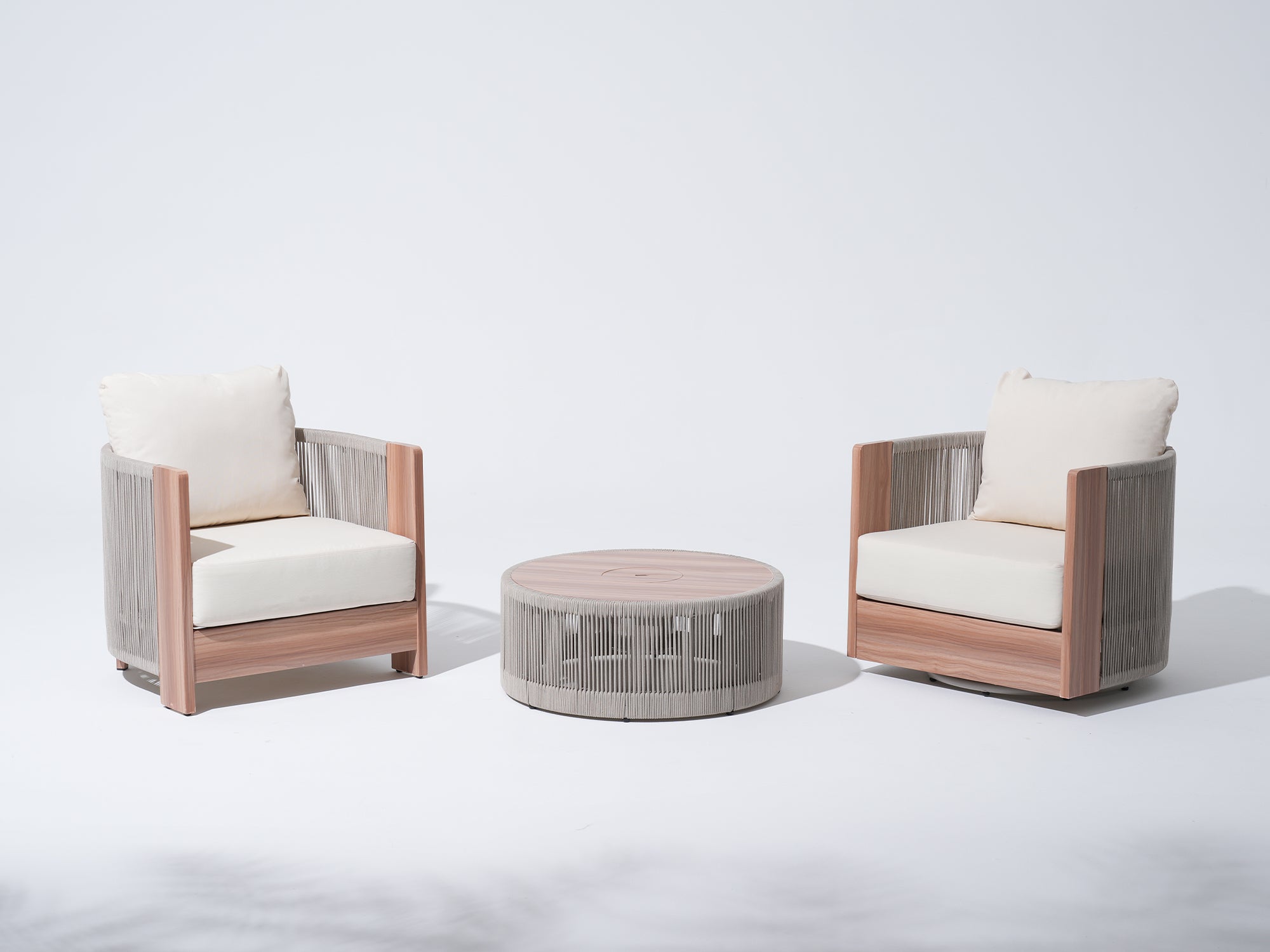 3-pc patio bistro set with white cushions, one wooden armchair, one swivel chair, and a matching round table, rope design