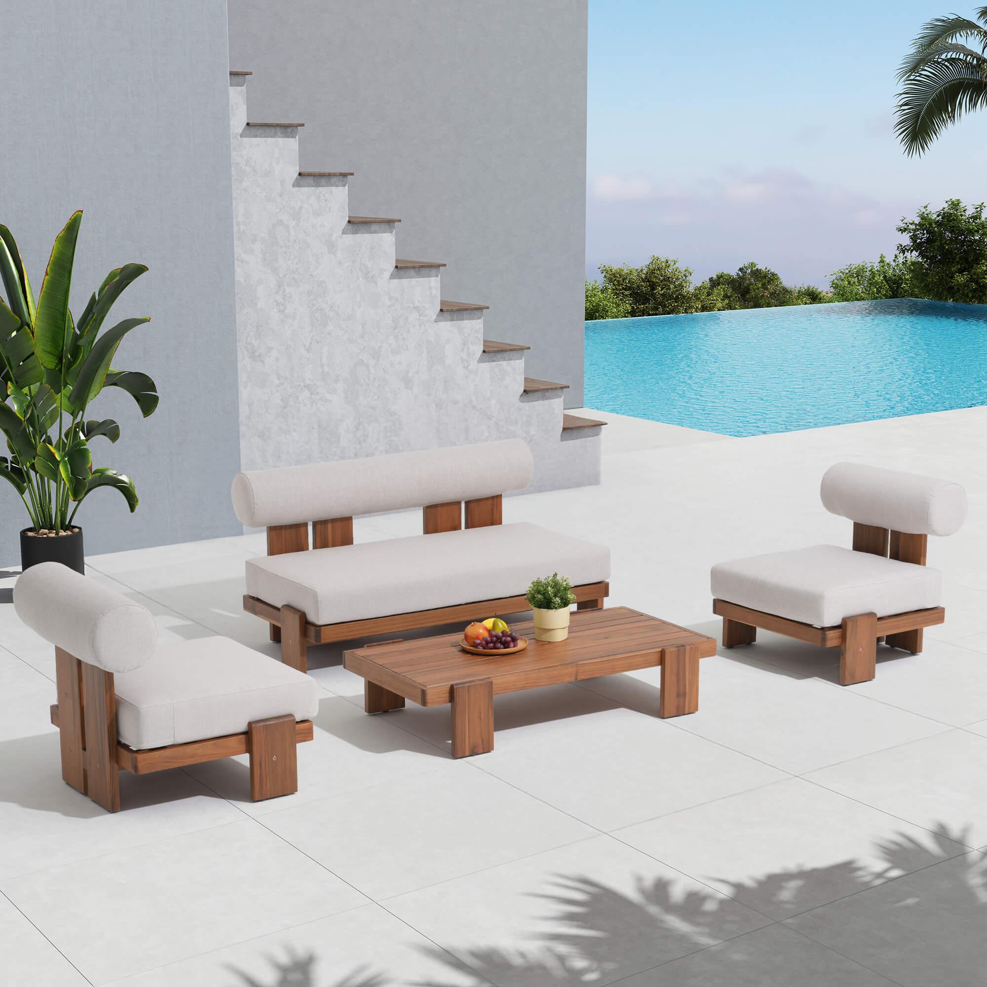 Outdoor furniture lounge set with acacia wooden frames and thick white cushions by a poolside- Jardina Modern Premium Outdoor Patio Furniture Sets