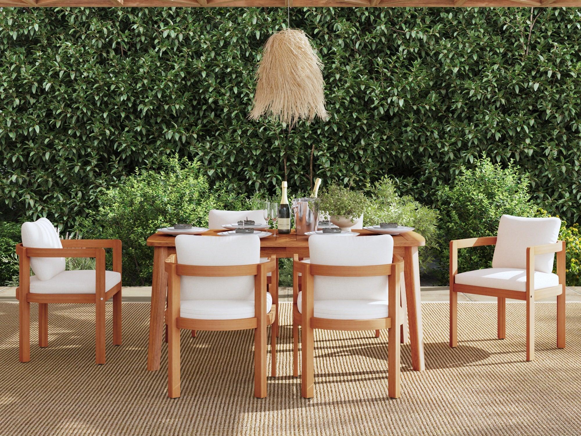 Outdoor dining set with acacia wooden table and chairs against a green hedge - Jardina Premium Modern Outdoor Dining Furniture#Size_63''