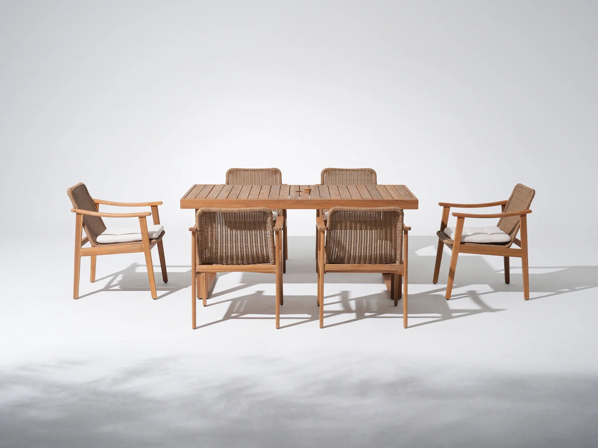 acacia Wooden umbrella hole outdoor dining table with four matching wicker chairs set for 6 people - Jardina Premium Modern Outdoor Dining Furniture