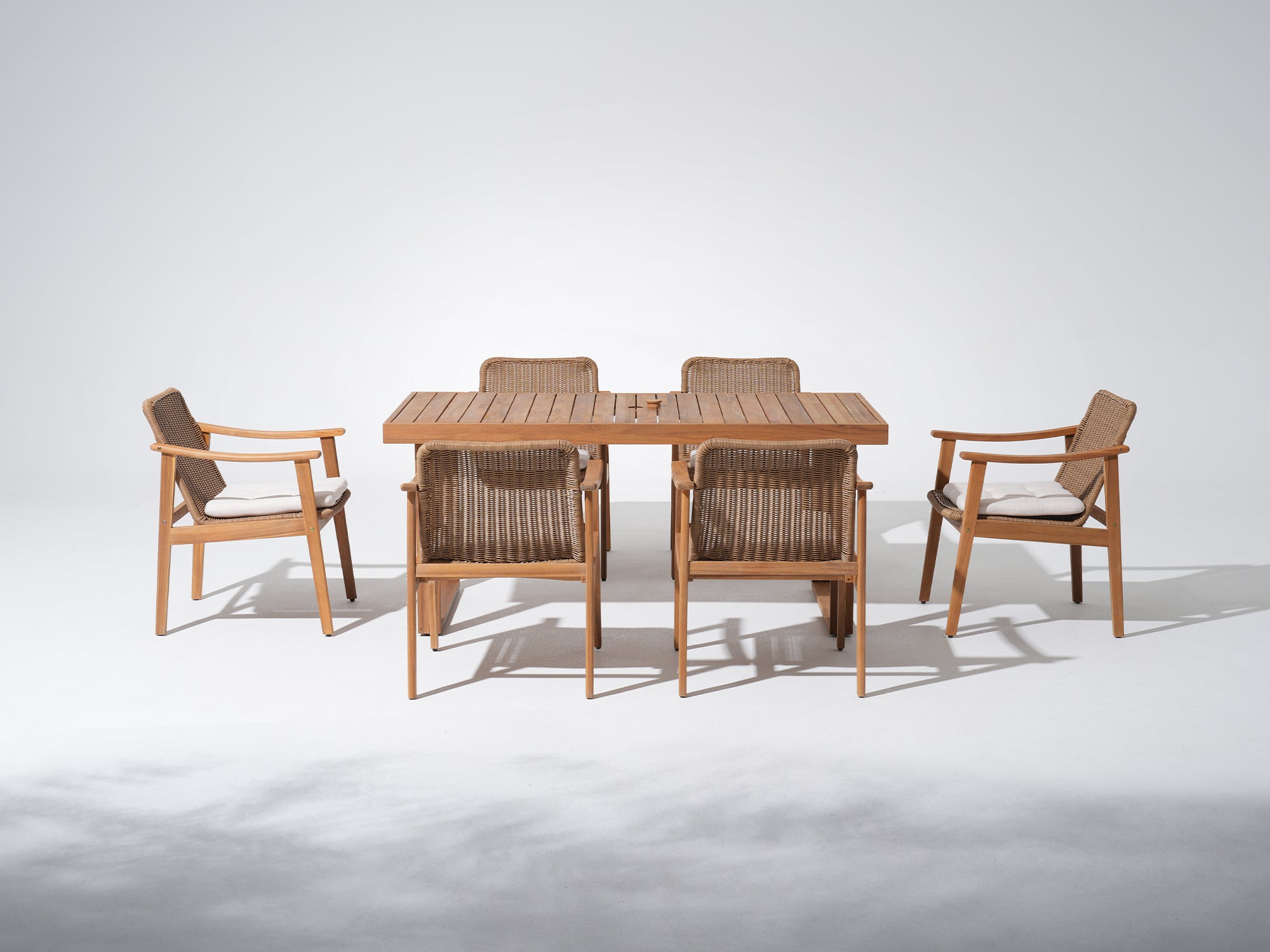 acacia Wooden umbrella hole outdoor dining table with four matching wicker chairs set for 6 people - Jardina Premium Modern Outdoor Dining Furniture