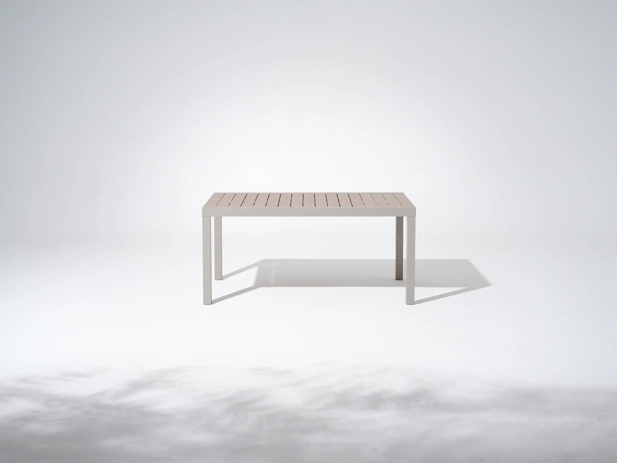 Minimalist white aluminum outdoor dining table with wooden tabletop