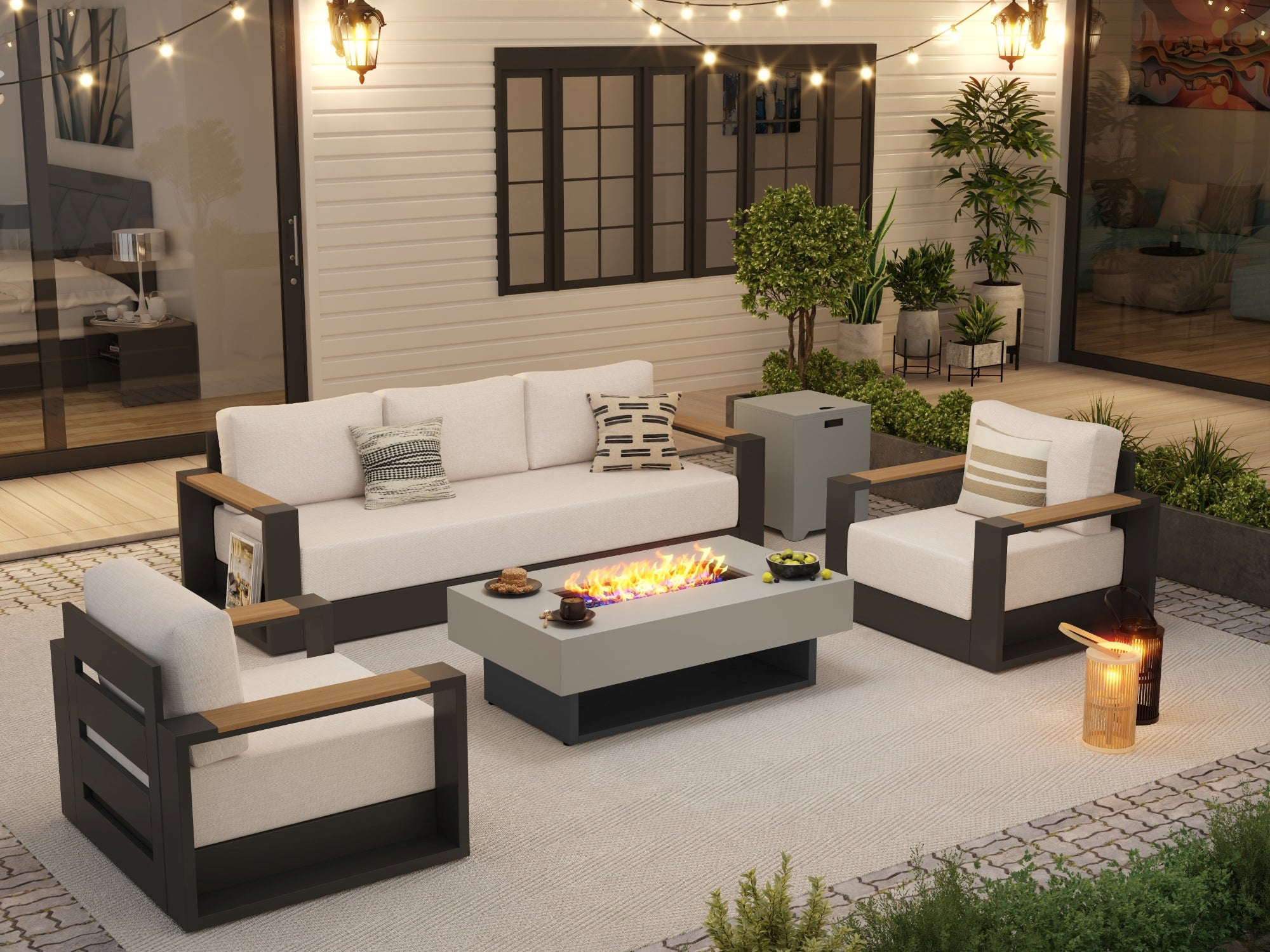 Outdoor patio set with fire pit table, chairs, and a sofa in a well-lit garden setting.