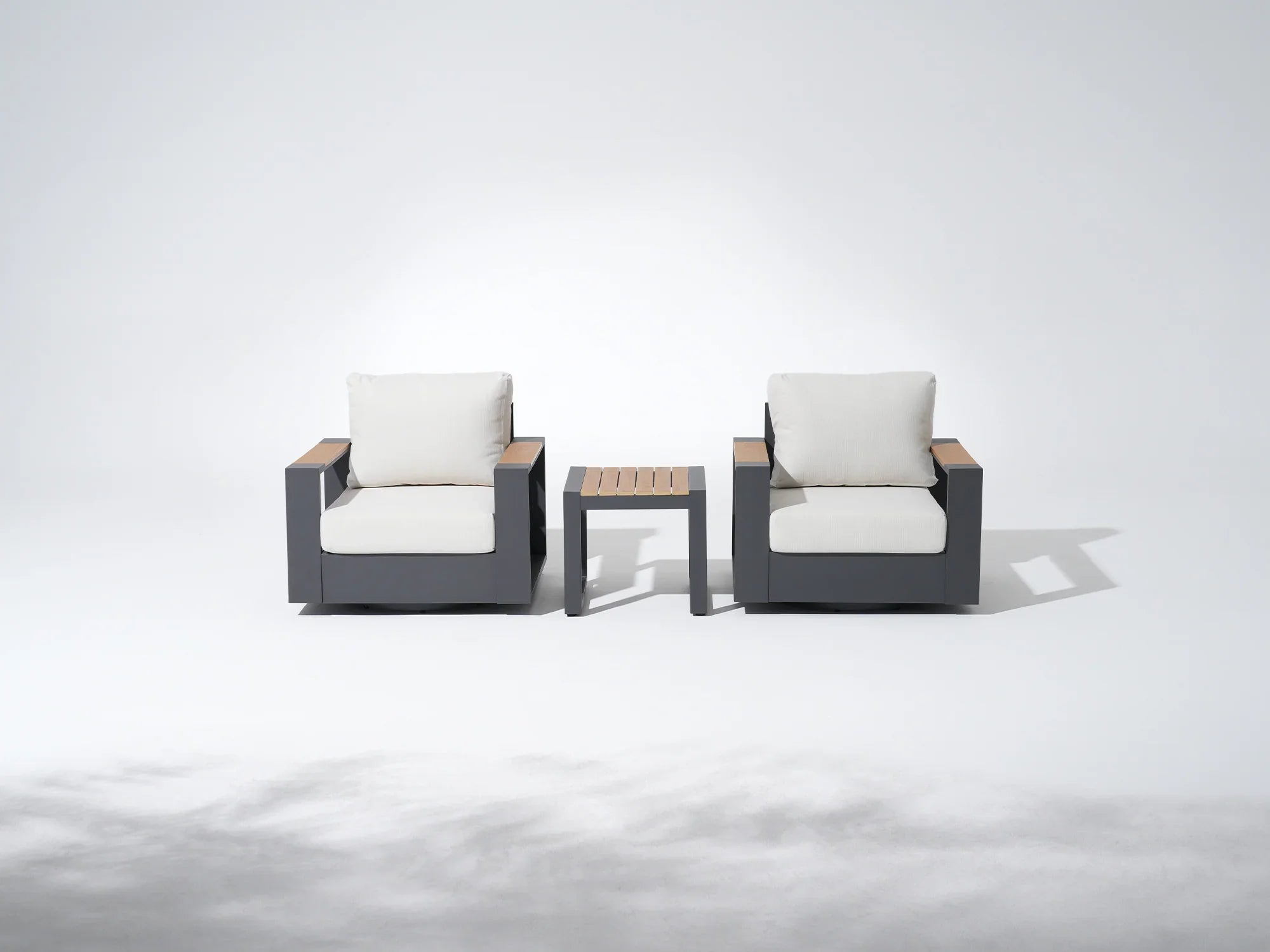 Addison modern patio bistro sets, two swivel sofas with white cushions and a small coffee table