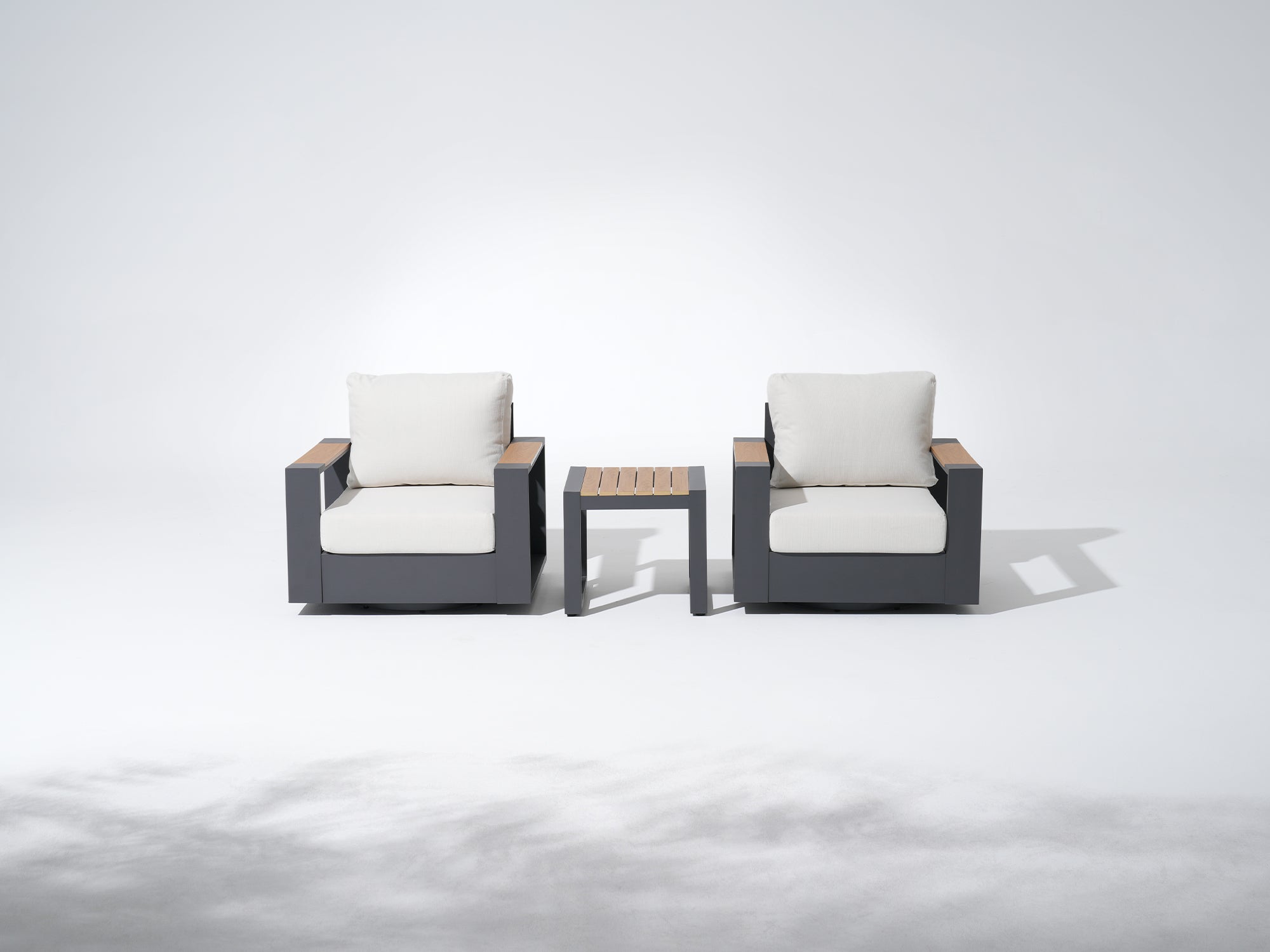 Addison modern patio bistro sets, two swivel sofas with white cushions and a small coffee table