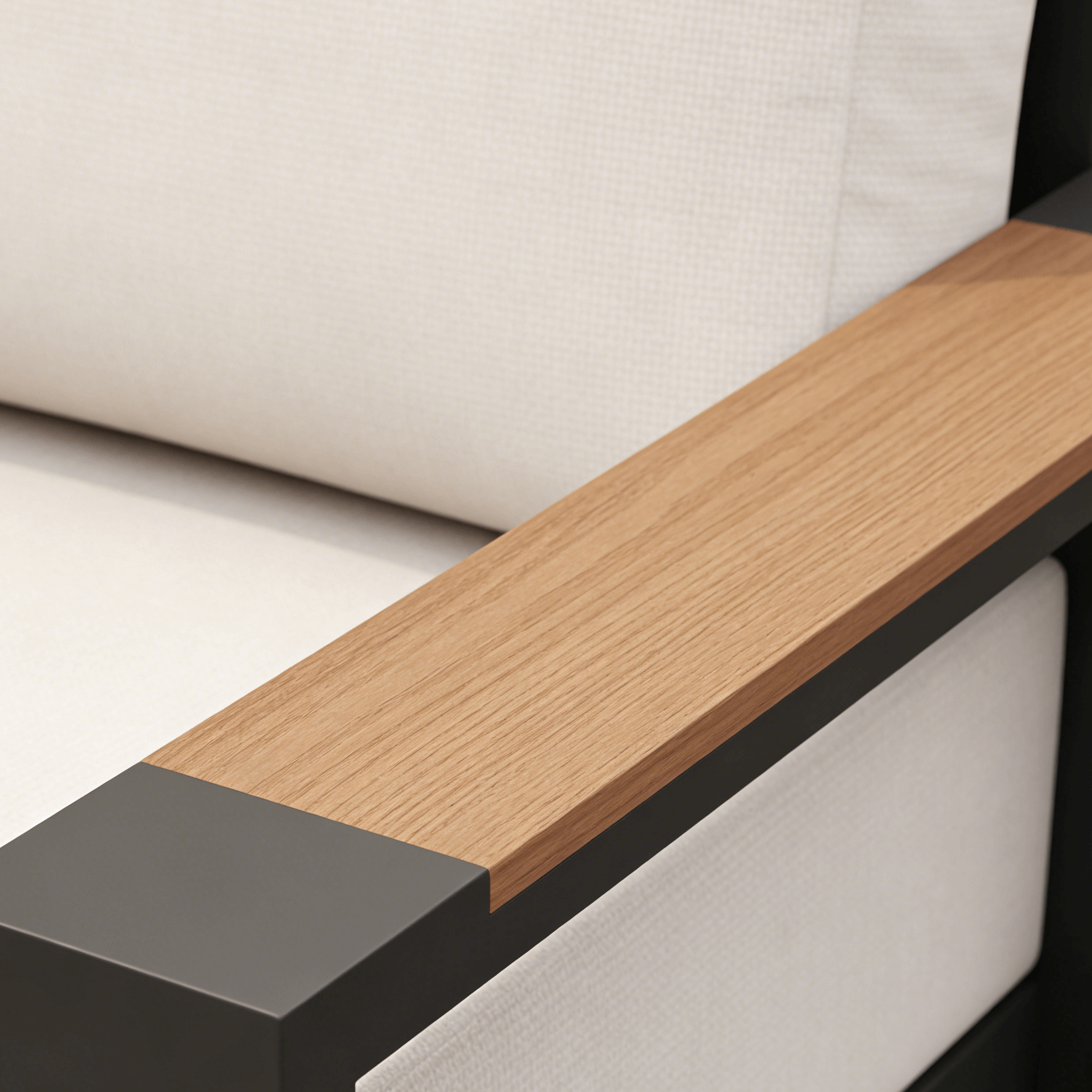 Close-up of a modern sofa with wooden armrest and black base.