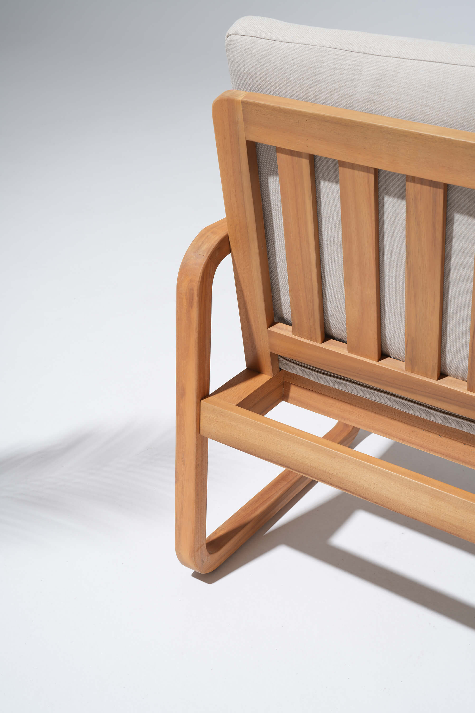 Wooden chair with a white cushion