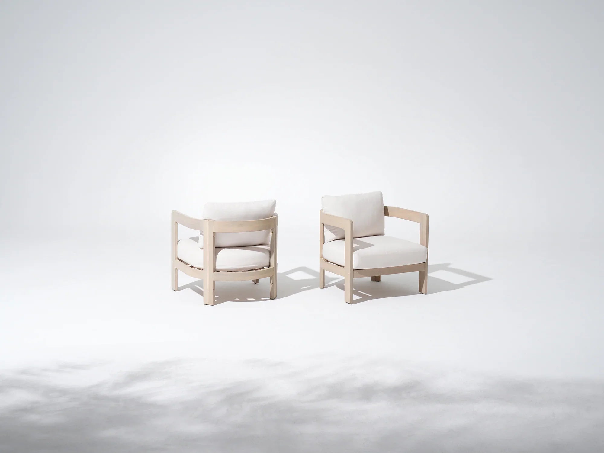Two modern acacia wood lounge chairs with white cushions - Jardina Modern Premium Outdoor Patio Furniture Sets
