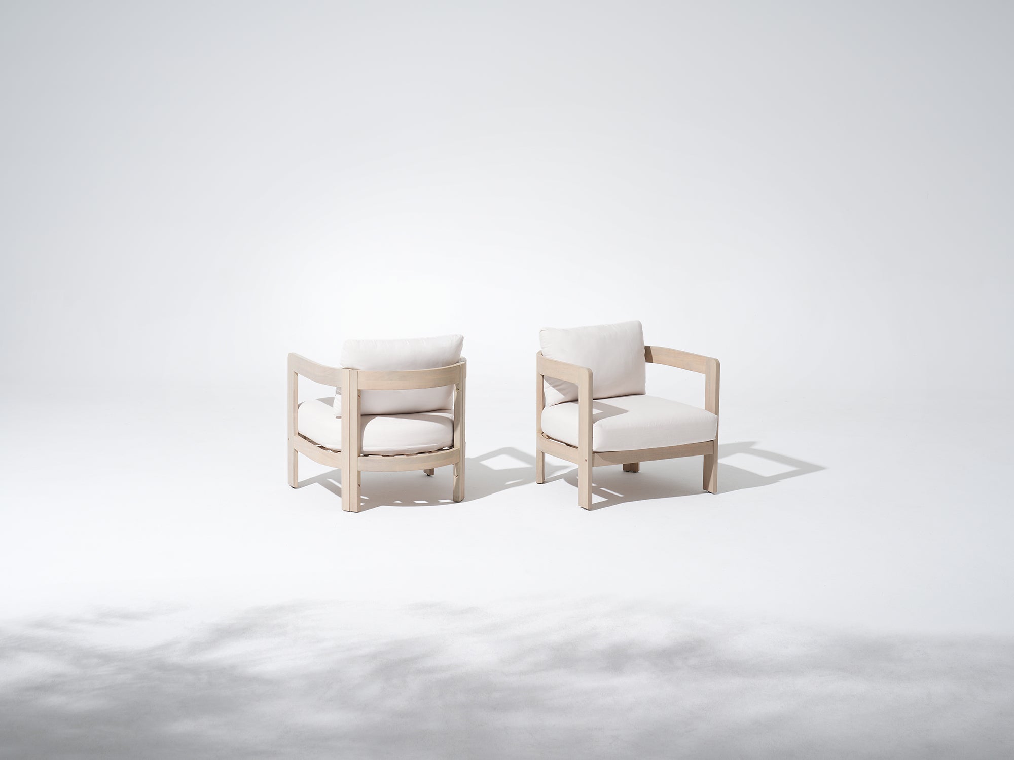 Two modern acacia wood lounge chairs with white cushions - Jardina Modern Premium Outdoor Patio Furniture Sets