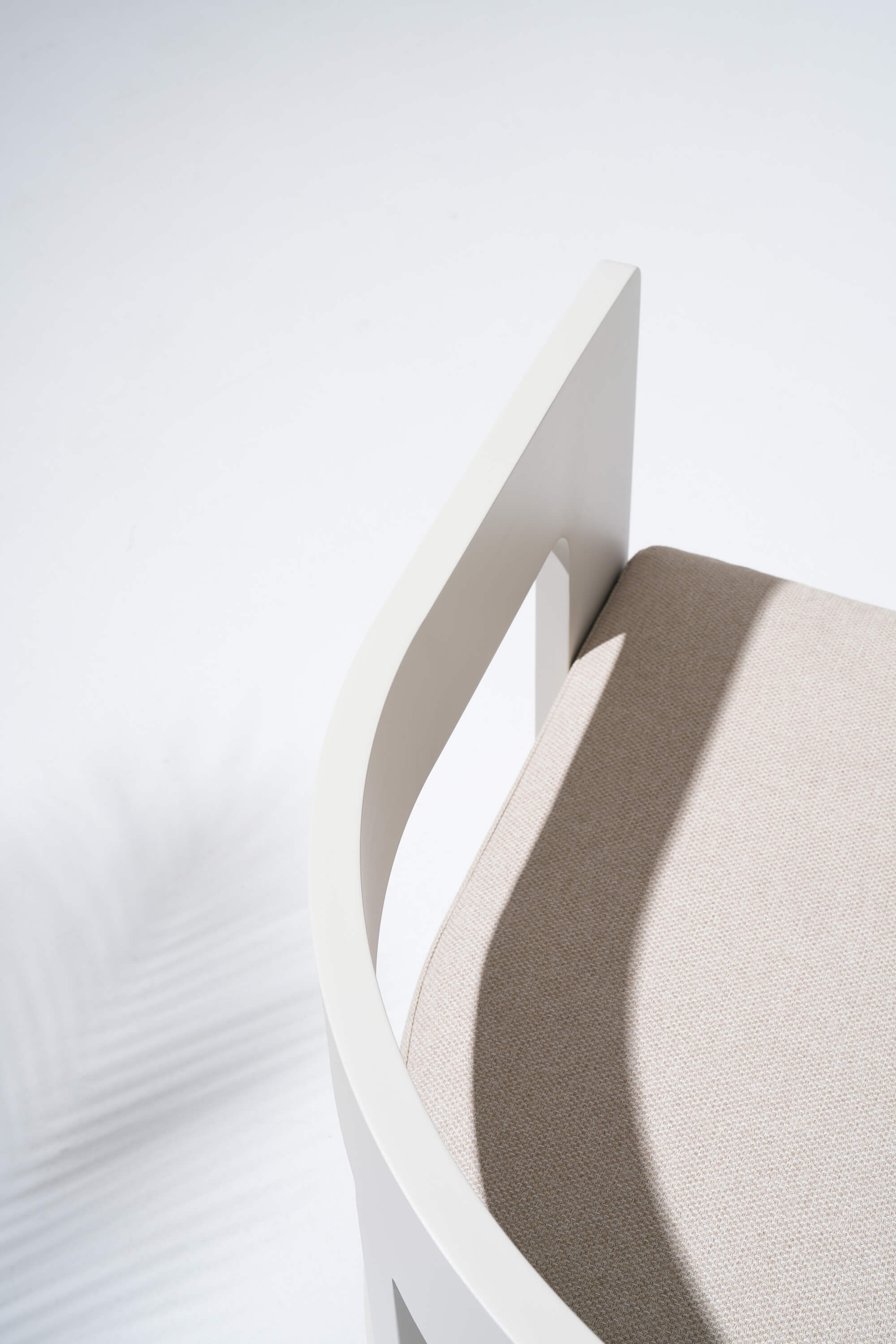 Modern white armchair with a geometric design