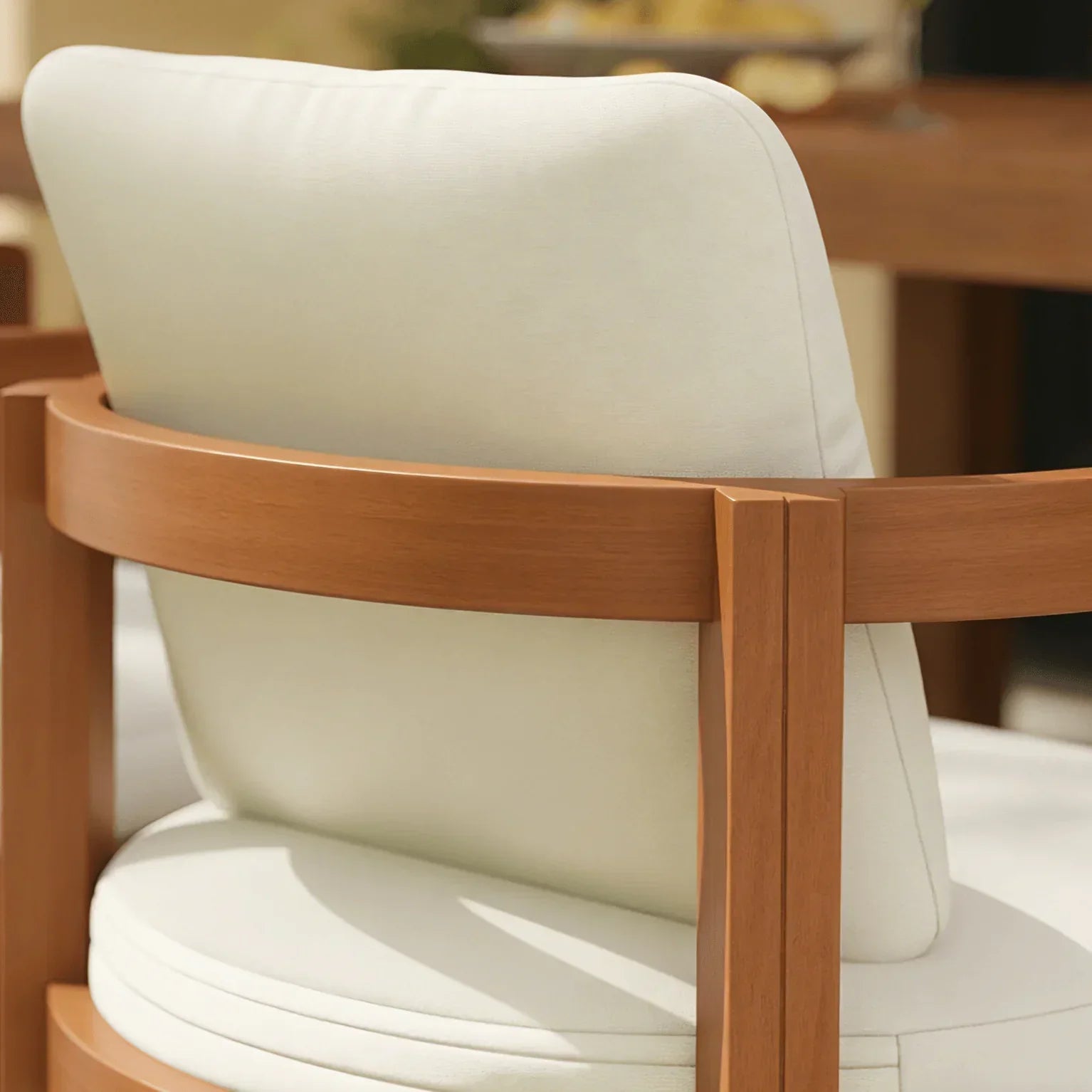 acacia Wooden chair with white cushion in a blurred indoor setting
