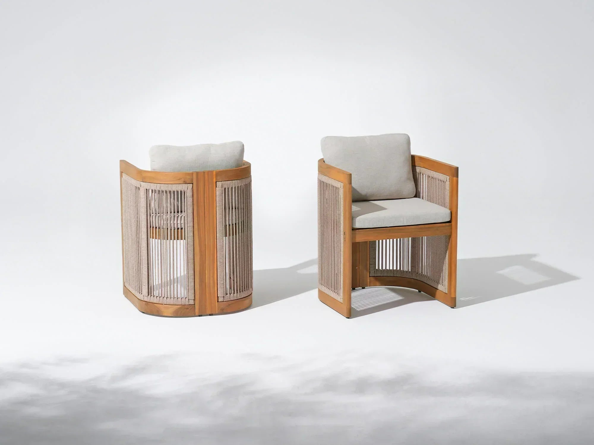 Two acacia wooden patio dining chairs with woven rope backrests and grey cushions- Jardina Modern Premium Patio Outdoor Furniture