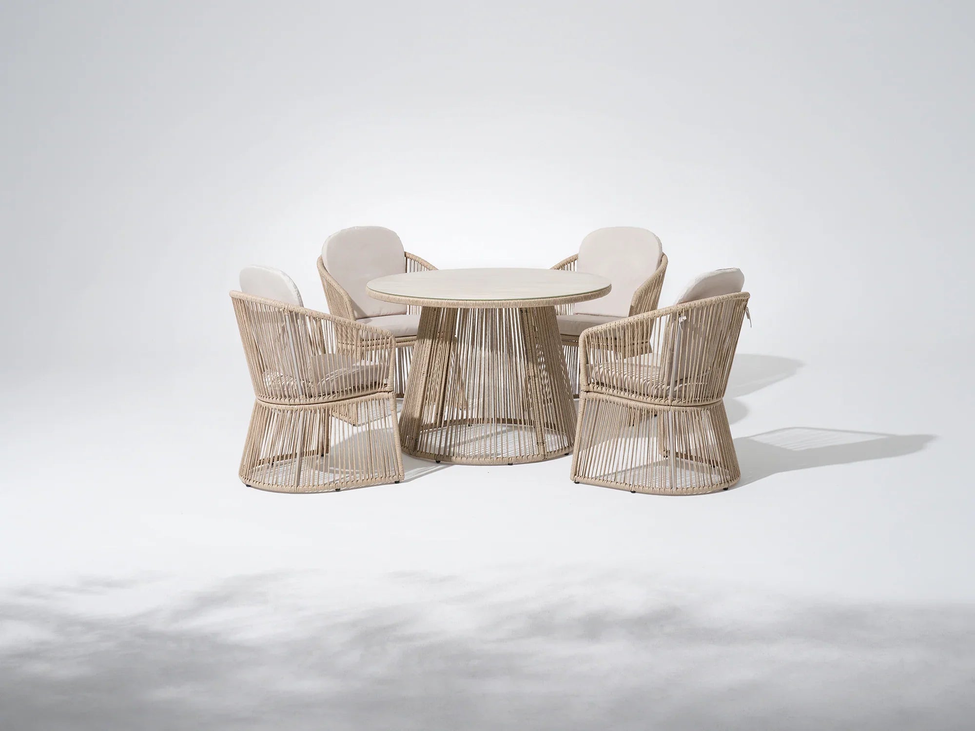 Round outdoor dining table with four matching wicker chairs for 4 people - Jardina Premium Modern Outdoor Dining Furniture