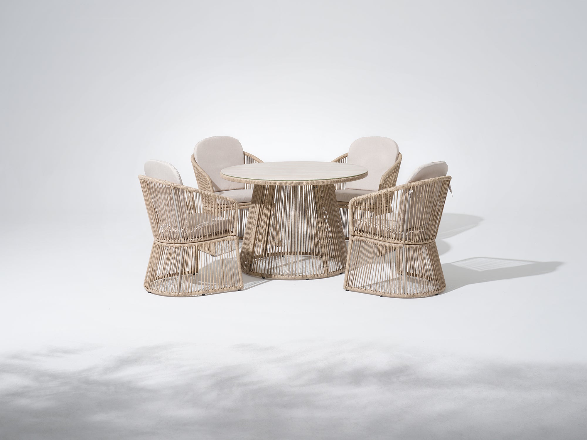Round outdoor dining table with four matching wicker chairs for 4 people - Jardina Premium Modern Outdoor Dining Furniture