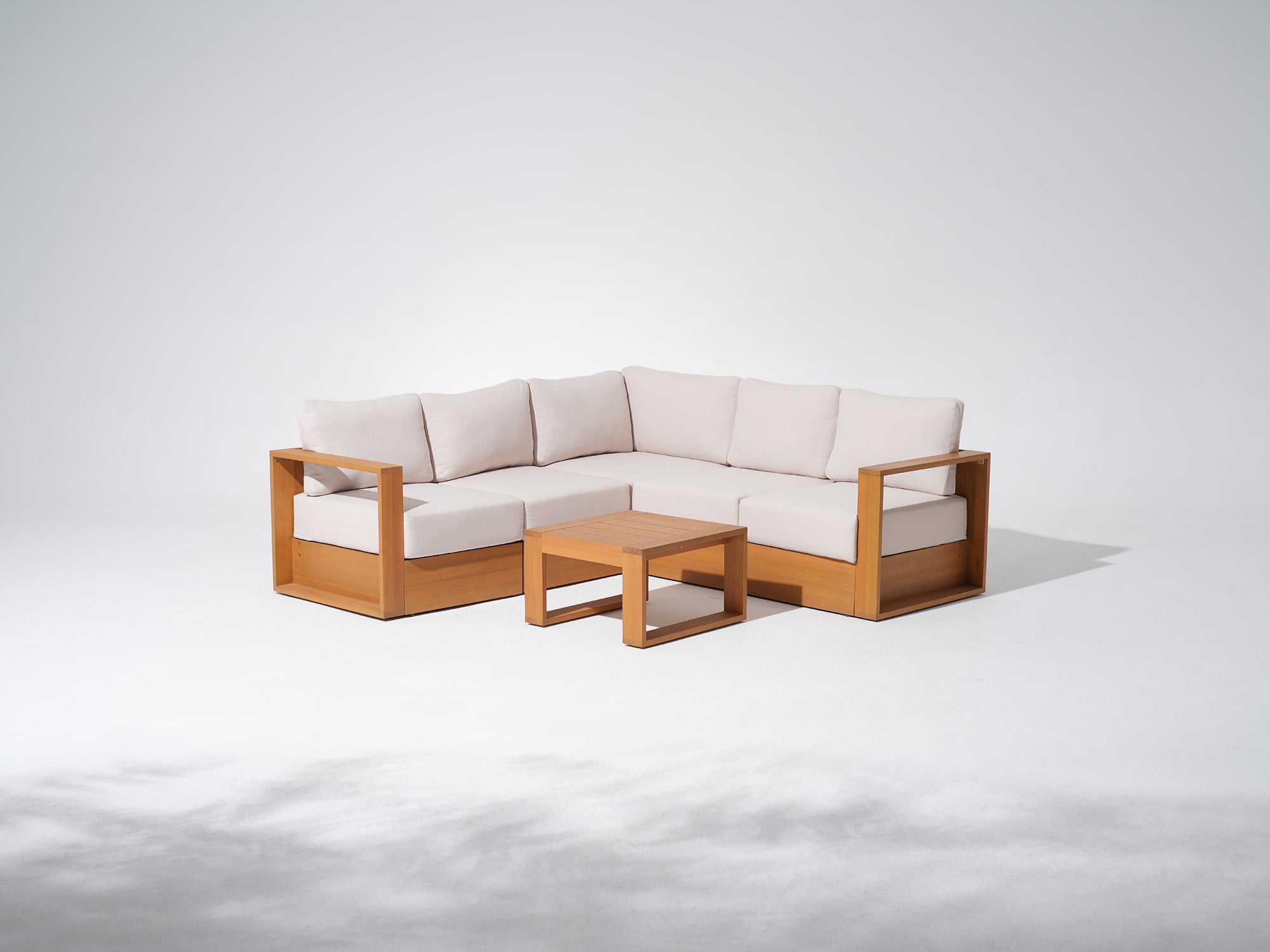 Sectional sofa with Eucalyptus wooden frame and light-colored cushions