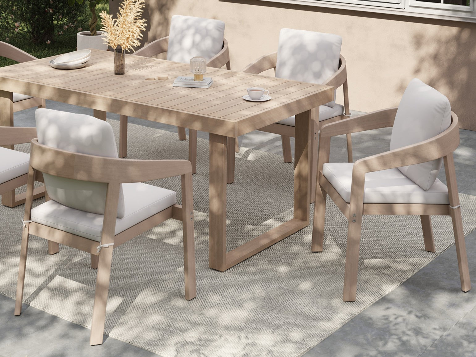 Eucalyptus Wooden outdoor dining table with chairs and cushions on a patio - Jardina Premium Modern Outdoor Dining Furniture