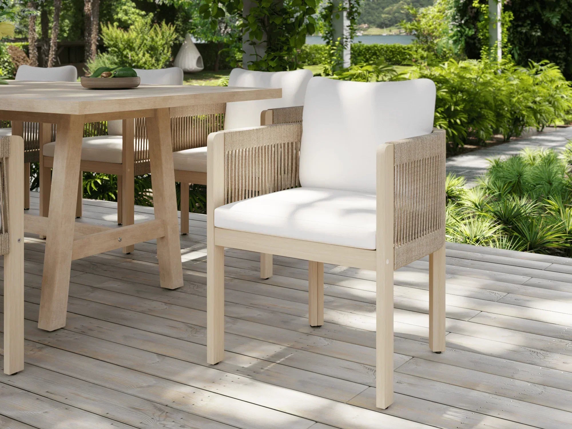Outdoor furniture dining set with acacia wooden table and chairs on a deck with greenery- Jardina Modern Premium Outdoor Patio Furniture Sets
