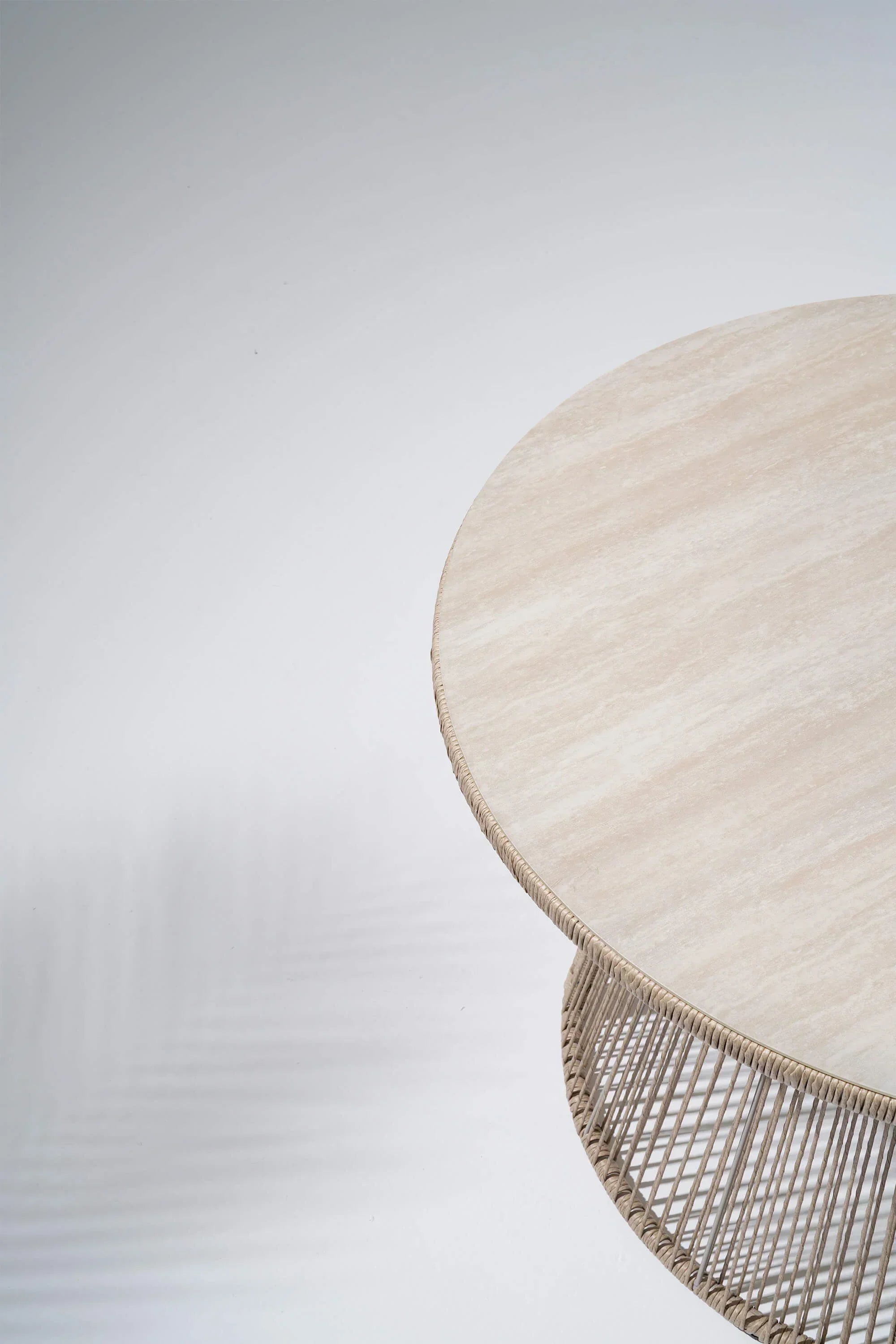 Round woven table with a textured surface