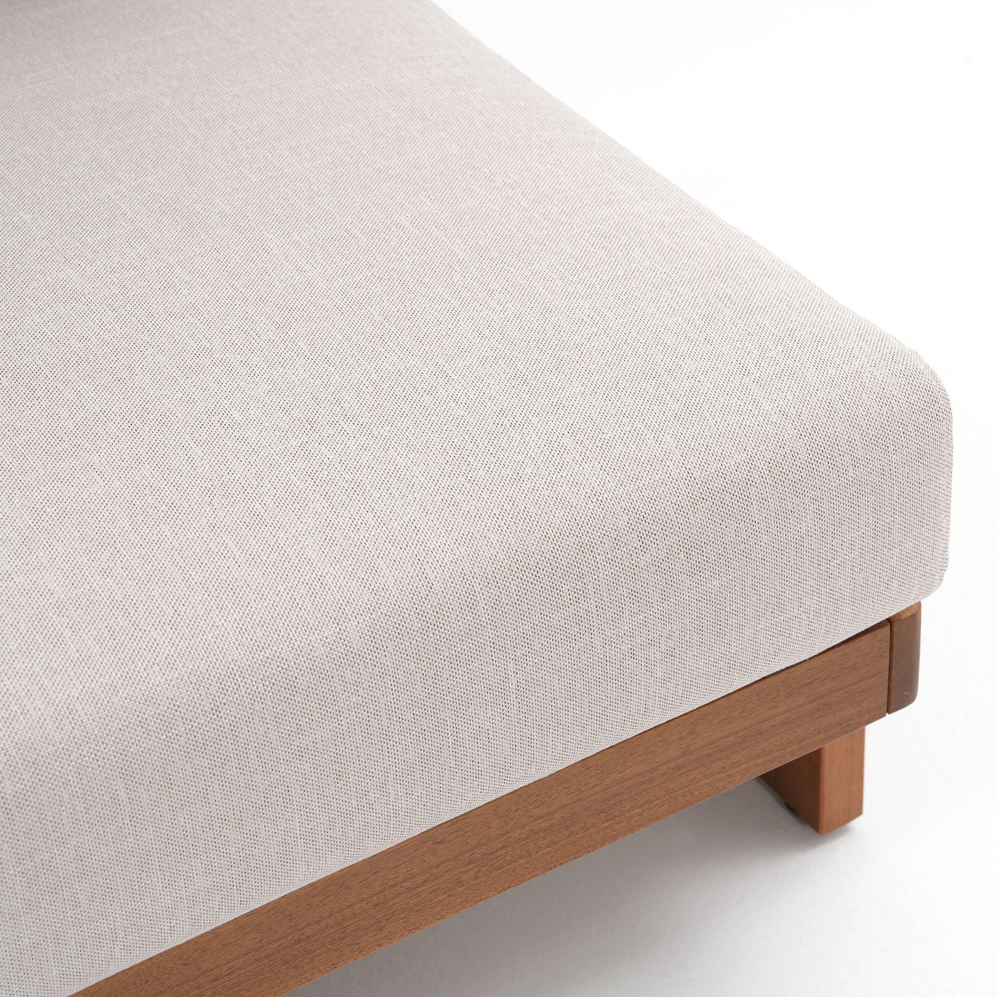 Close-up of a light gray upholstered chair with wooden legs, cushion detail- Jardina Modern Premium Outdoor Patio Furniture Sets