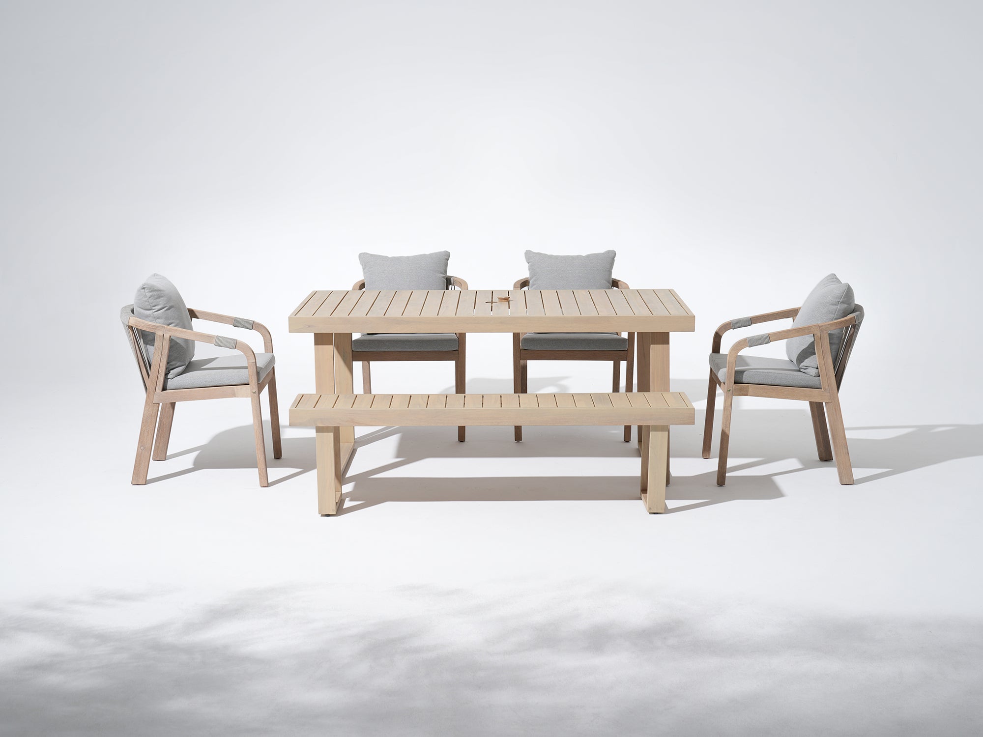 Thalea Outdoor furniture set for 6 with 4 dining chairs, a bench and a rectangular table with umbrella hole