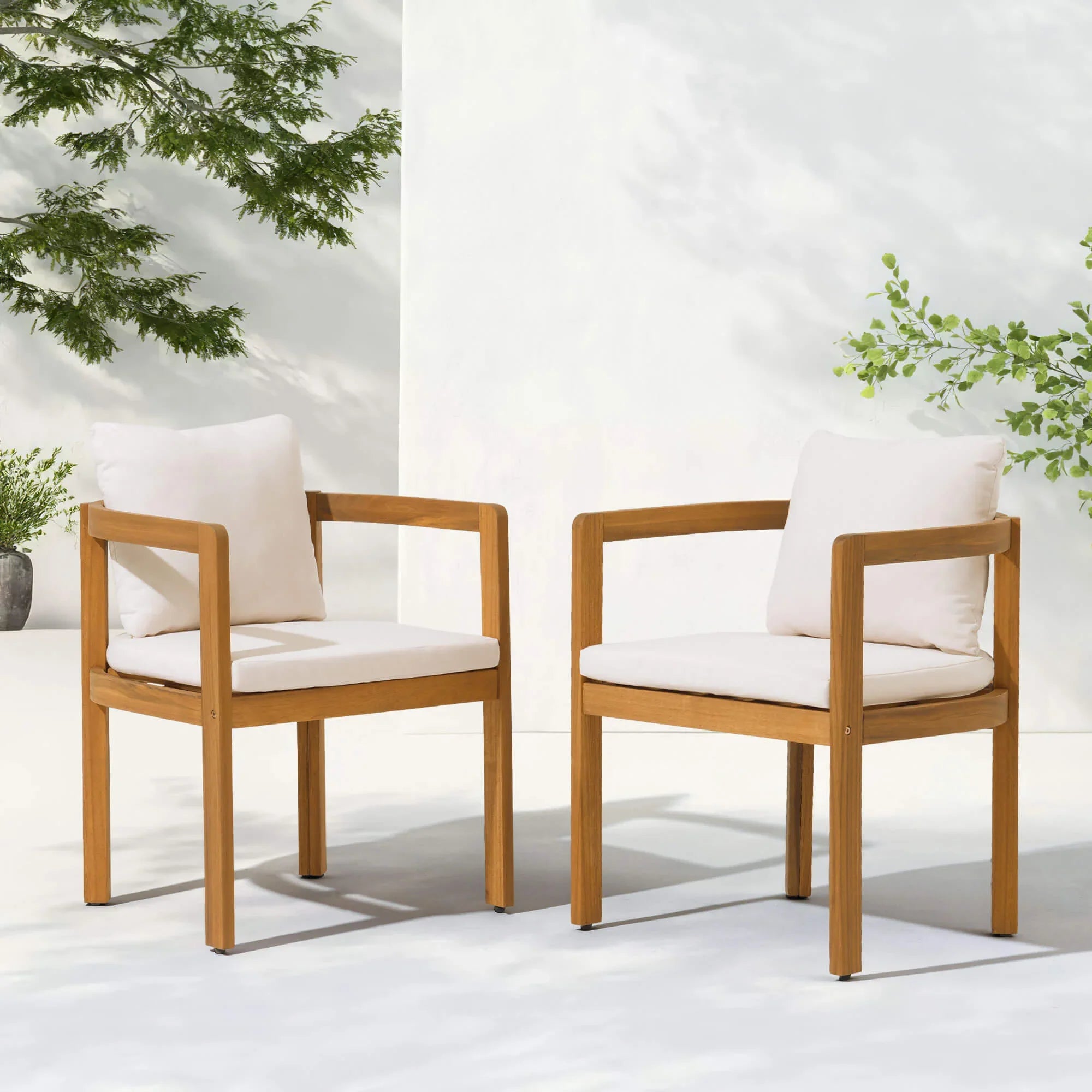 Two acacia wooden outdoor dining chairs with white cushions- Jardina Modern Premium Patio Outdoor Furniture