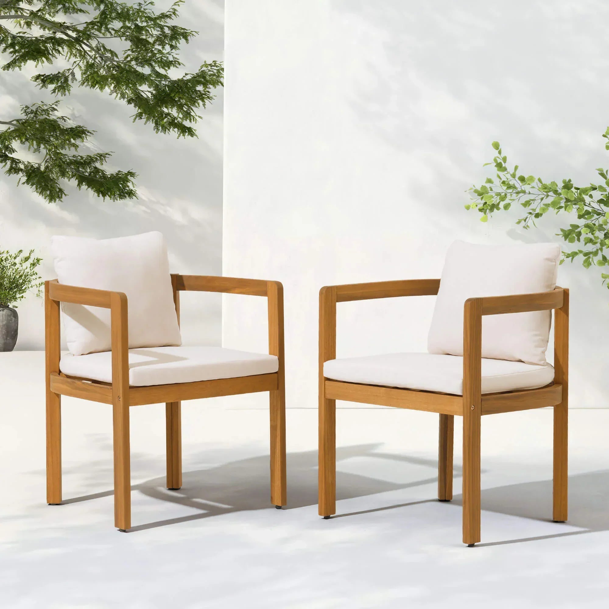 Two acacia wooden outdoor dining chairs with white cushions- Jardina Modern Premium Patio Outdoor Furniture