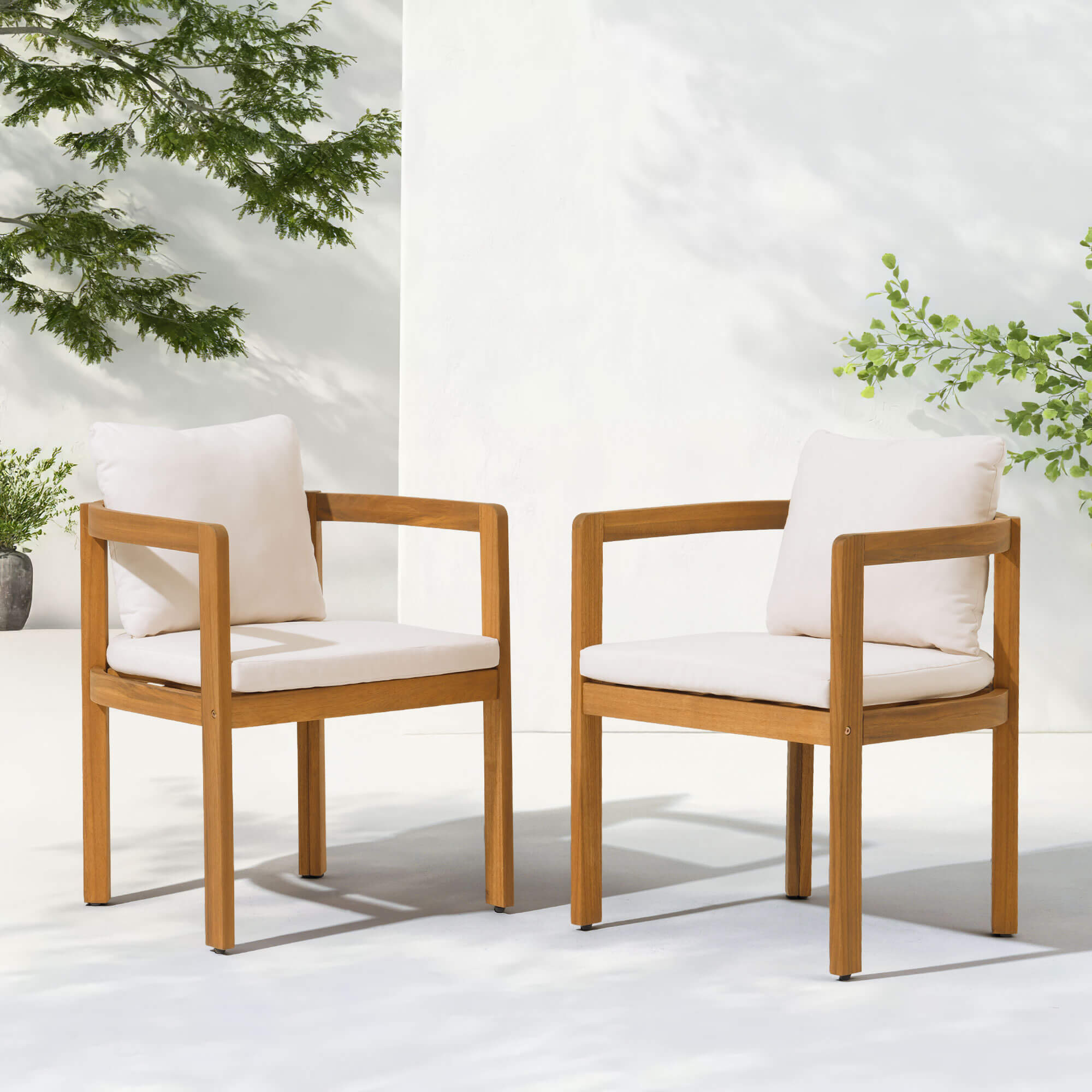 Two acacia wooden outdoor dining chairs with white cushions- Jardina Modern Premium Patio Outdoor Furniture