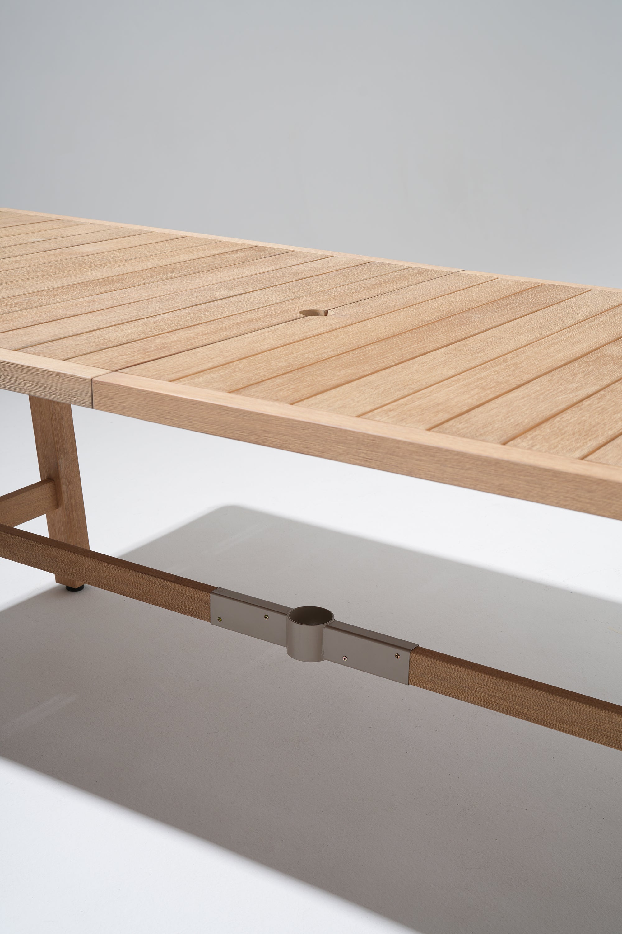 Wooden outdoor table with a hinge on a gray background