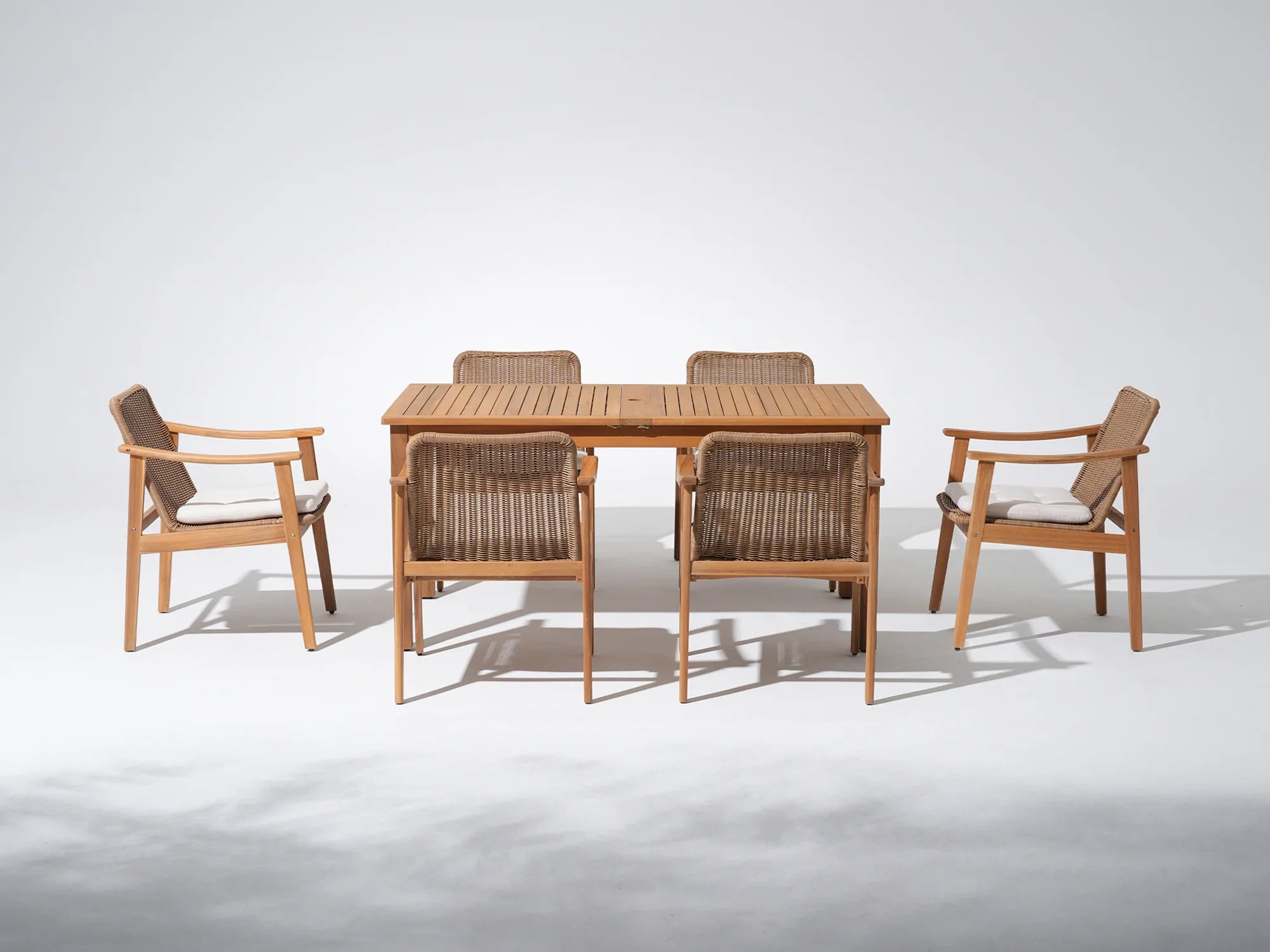 acacia Wooden umbrella hole dining table for 6 with four matching wicker chairs - Jardina Premium Modern Outdoor Dining Furniture