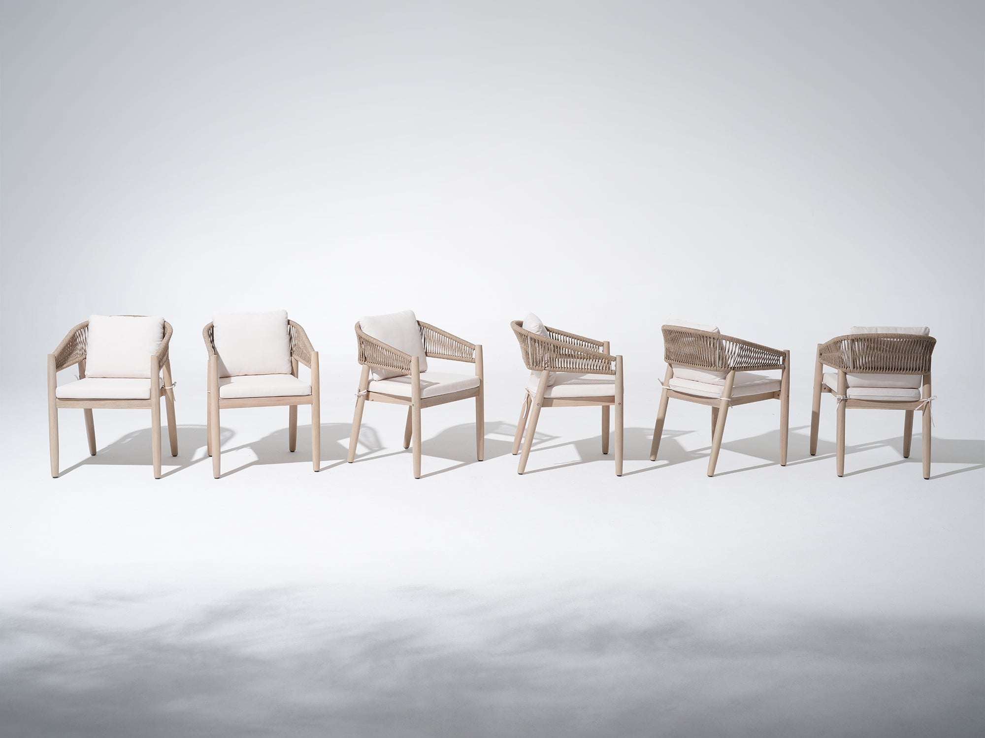 Set of six wooden rope dining chairs with white cushions