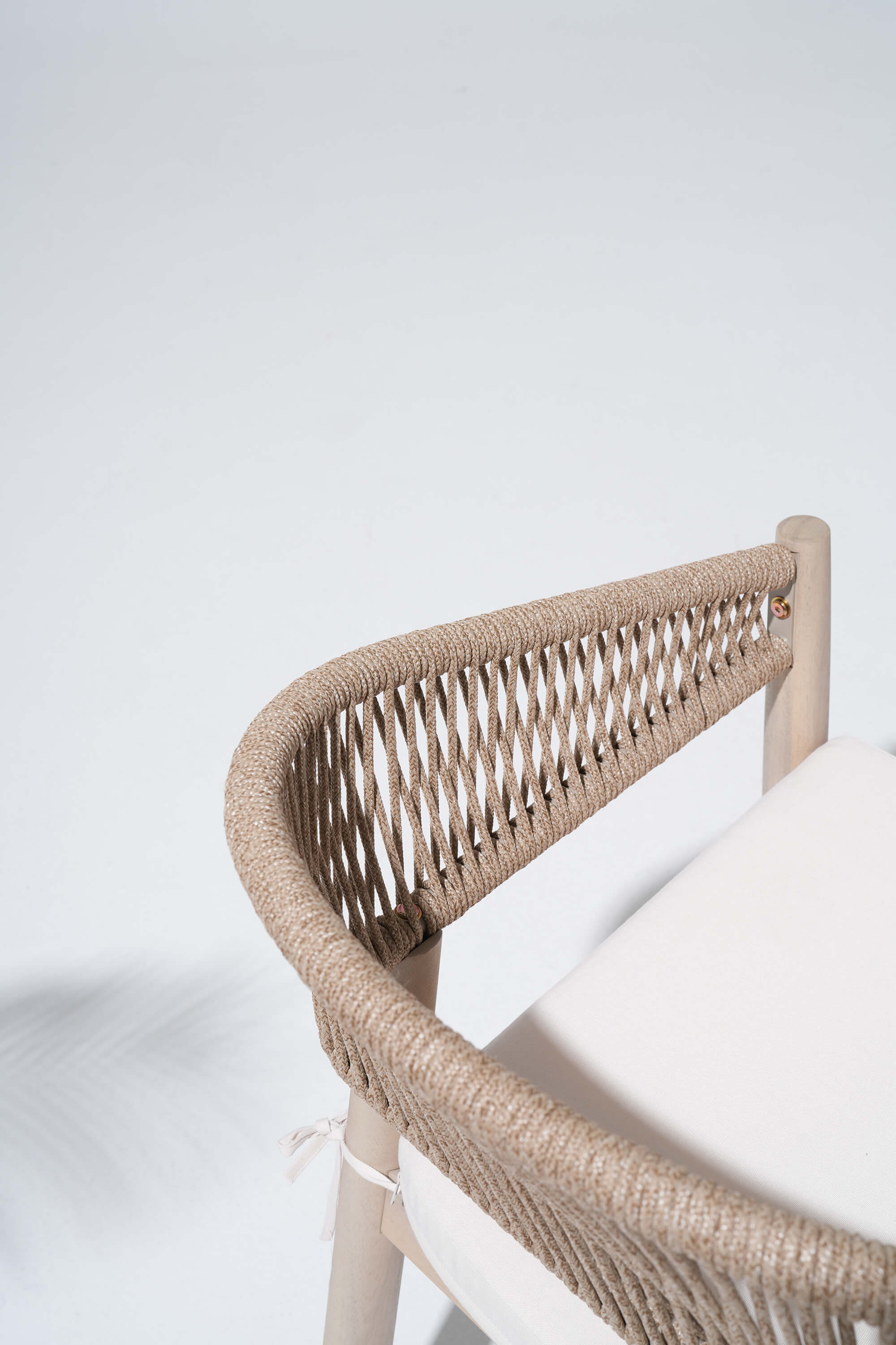 Wicker chair with a white cushion
