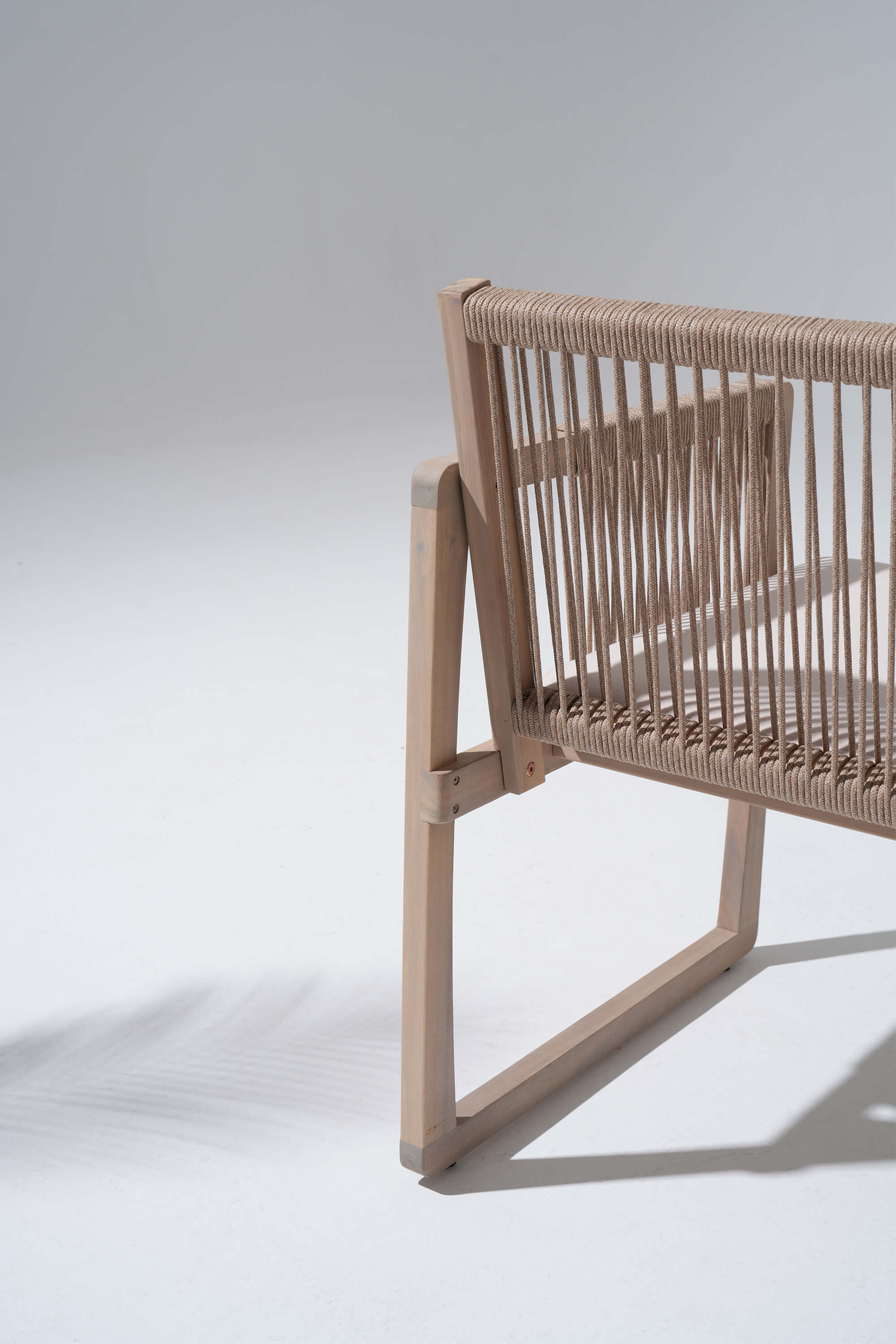 Woven chair with natural acacia wood frame