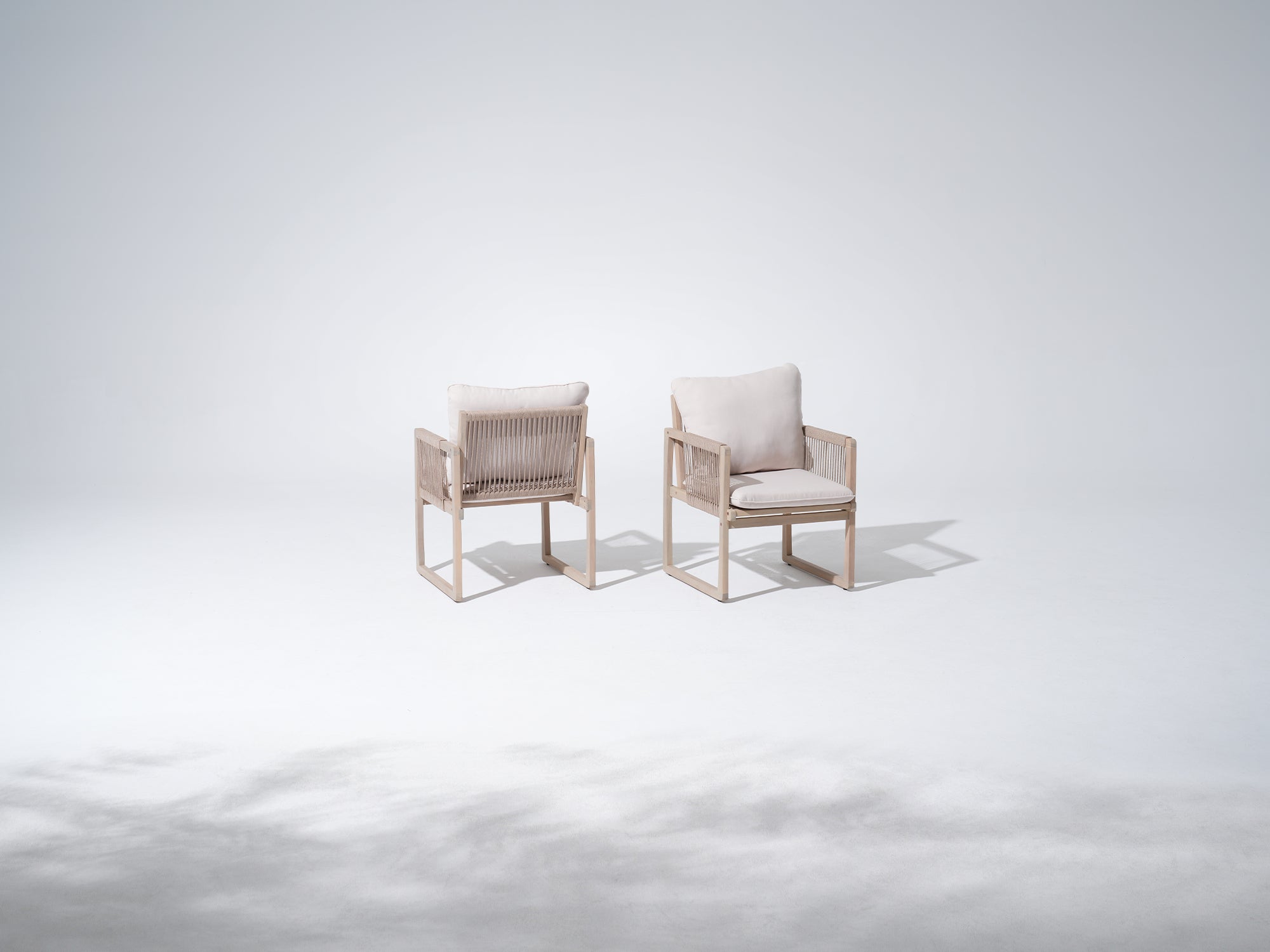 Two acacia wooden chairs with white cushions and rope armrest and backrest - Jardina Premium Modern Outdoor Dining Furniture
