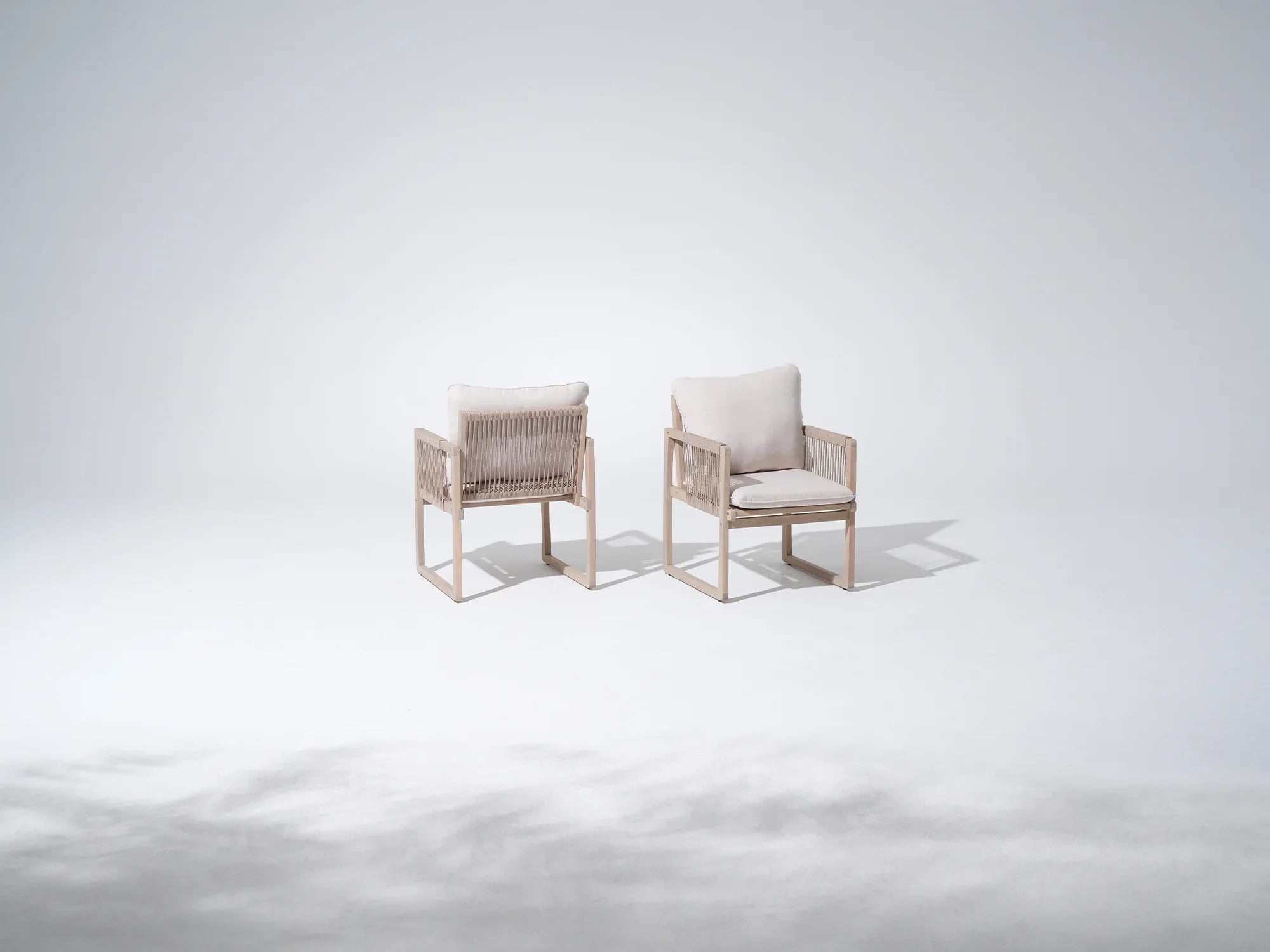 Two acacia wooden chairs with white cushions and rope armrest and backrest - Jardina Premium Modern Outdoor Dining Furniture