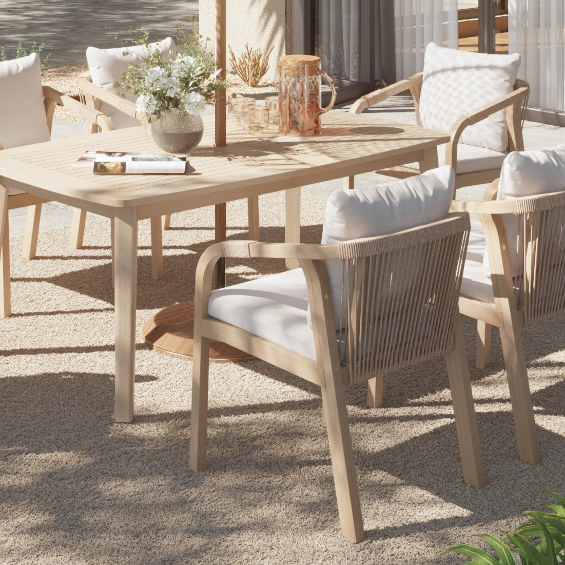 Outdoor dining set with acacia wooden table and chairs on a patio - Jardina Premium Modern Outdoor Dining Furniture