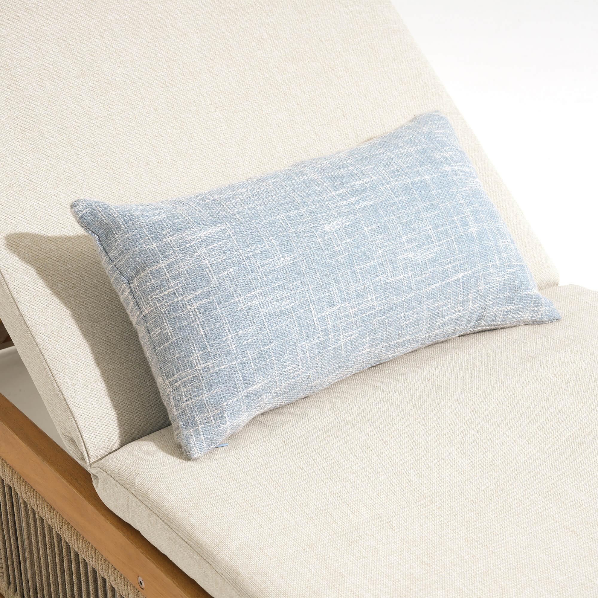 Blue textured pillow on a beige wood lounge chair - Jardina Modern Premium Outdoor Patio Furniture Sets