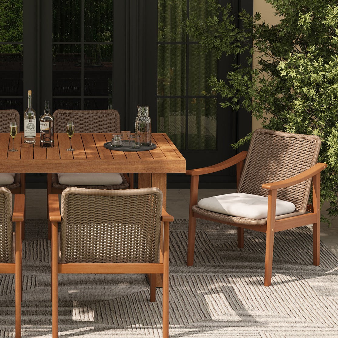Outdoor dining set with acacia wooden table and wicker chairs on a patio - Jardina Premium Modern Outdoor Dining Furniture