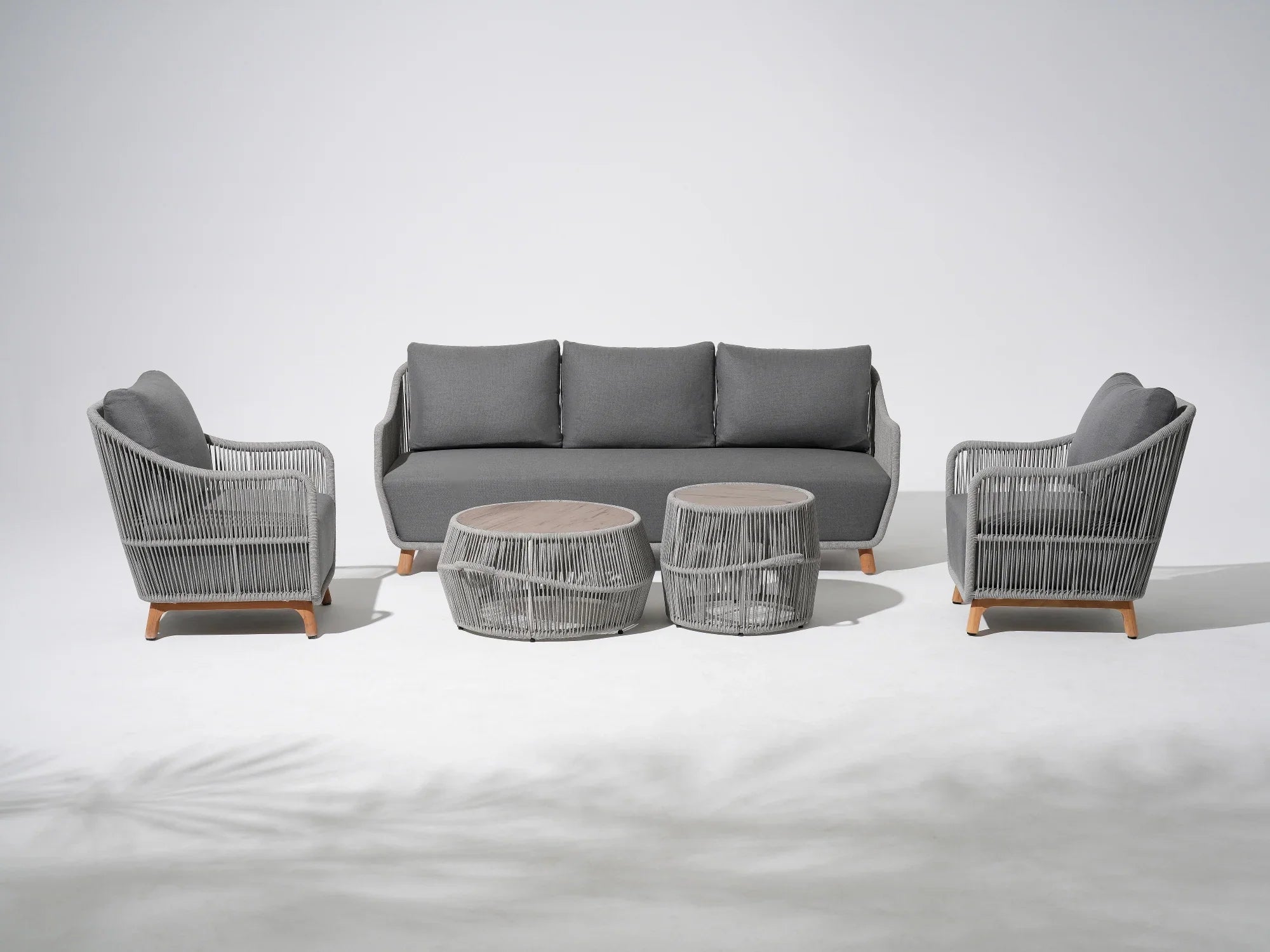 5-pcs Outdoor seating conversation set with gray seat cushions and back cushions, a 3-seat sofa, two single sofa armchairs with gray rope design, two round outdoor coffee tables with the same rope design - Jardina Premium Modern Outdoor Patio Furniture Set