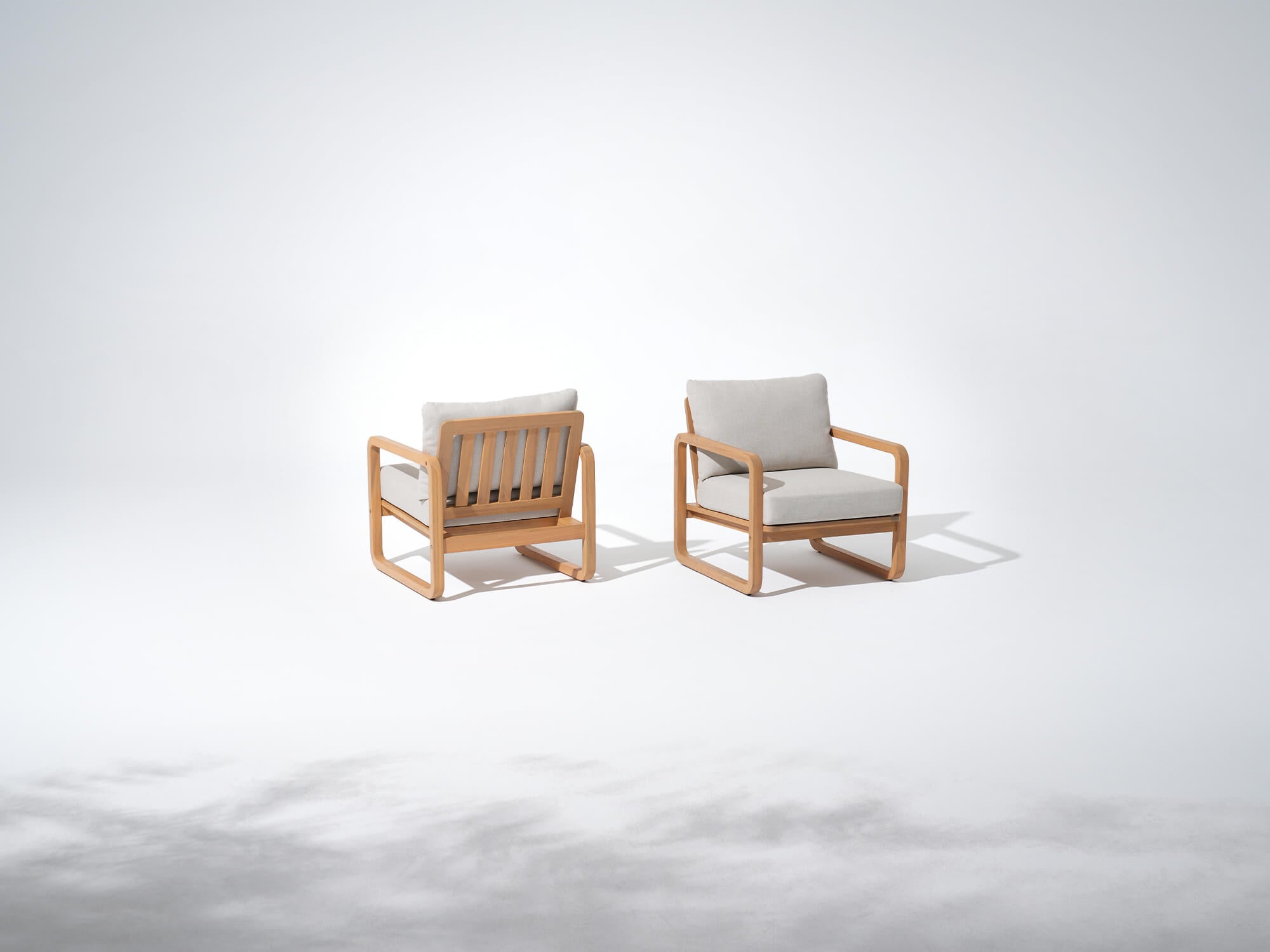 Two wooden lounge chairs with comf thick cushions