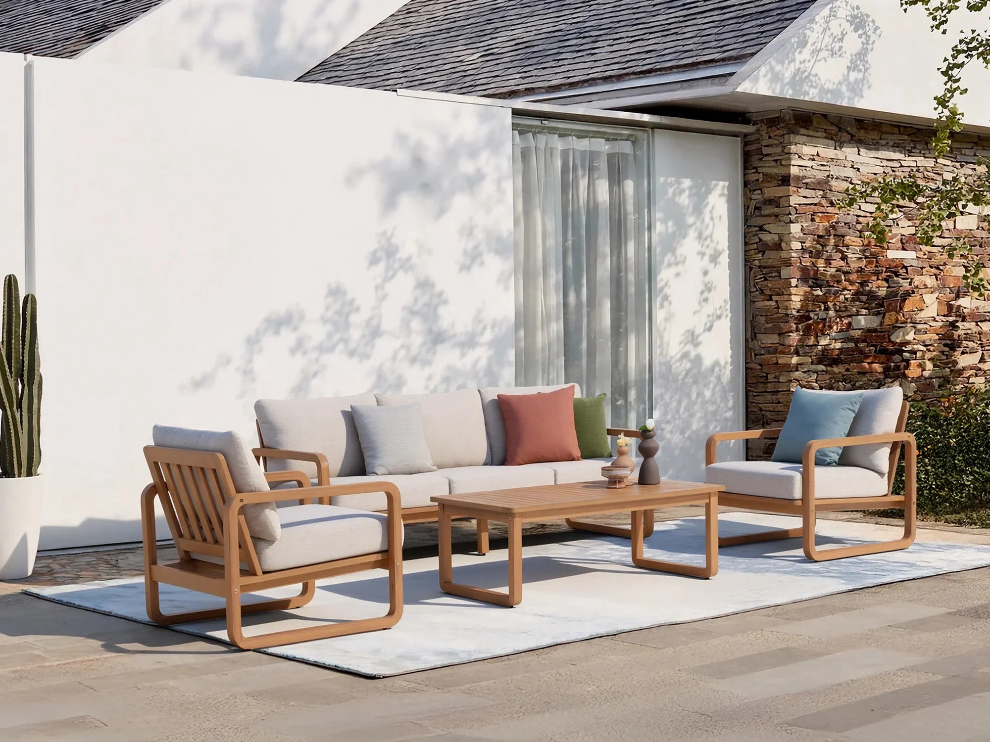 5 seats acacia wooden Outdoor patio conversation seating set with beige cushions on a patio - Jardina Modern Premium Outdoor Patio Furniture Sets