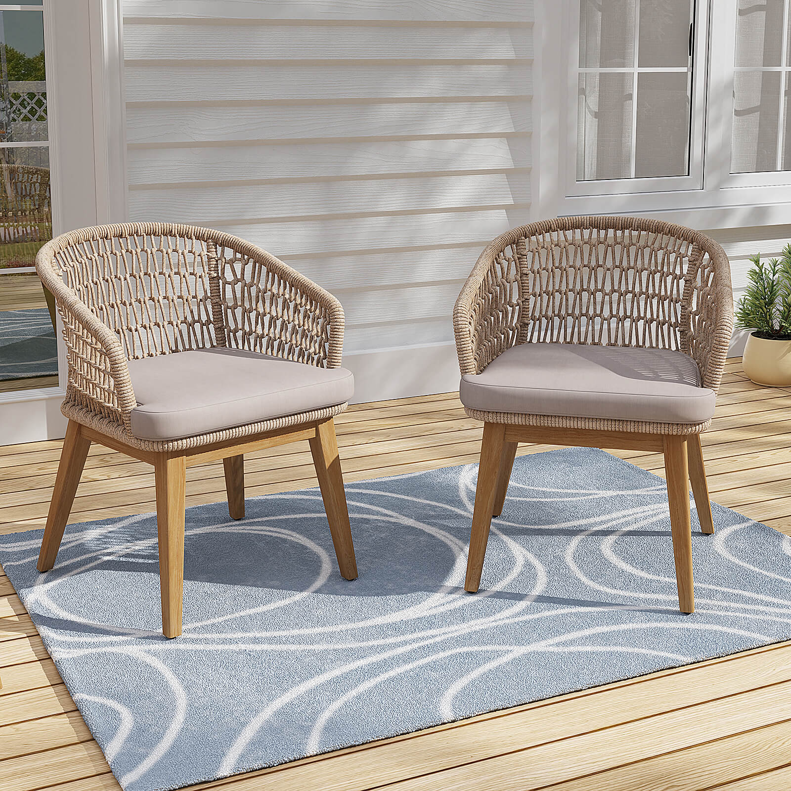Two rope and wooden outdoor chairs with beige cushions on a wooden deck with a blue patterned rug- Jardina Modern Premium Patio Outdoor Furniture