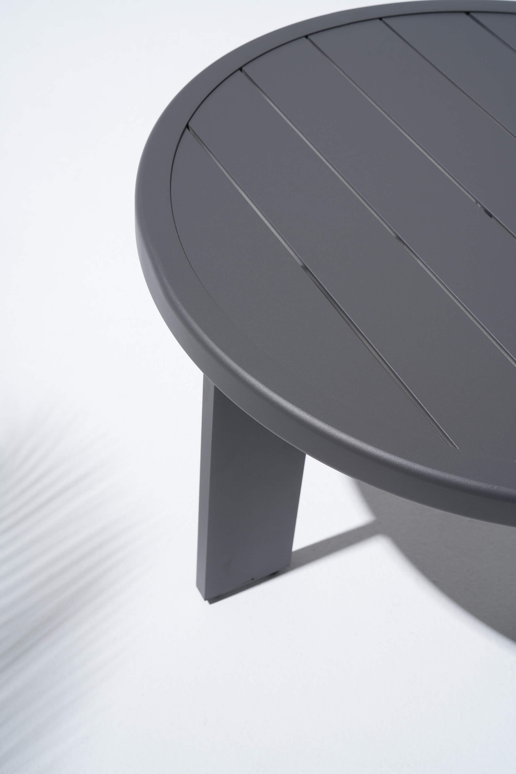 Round gray coffee table in aluminum